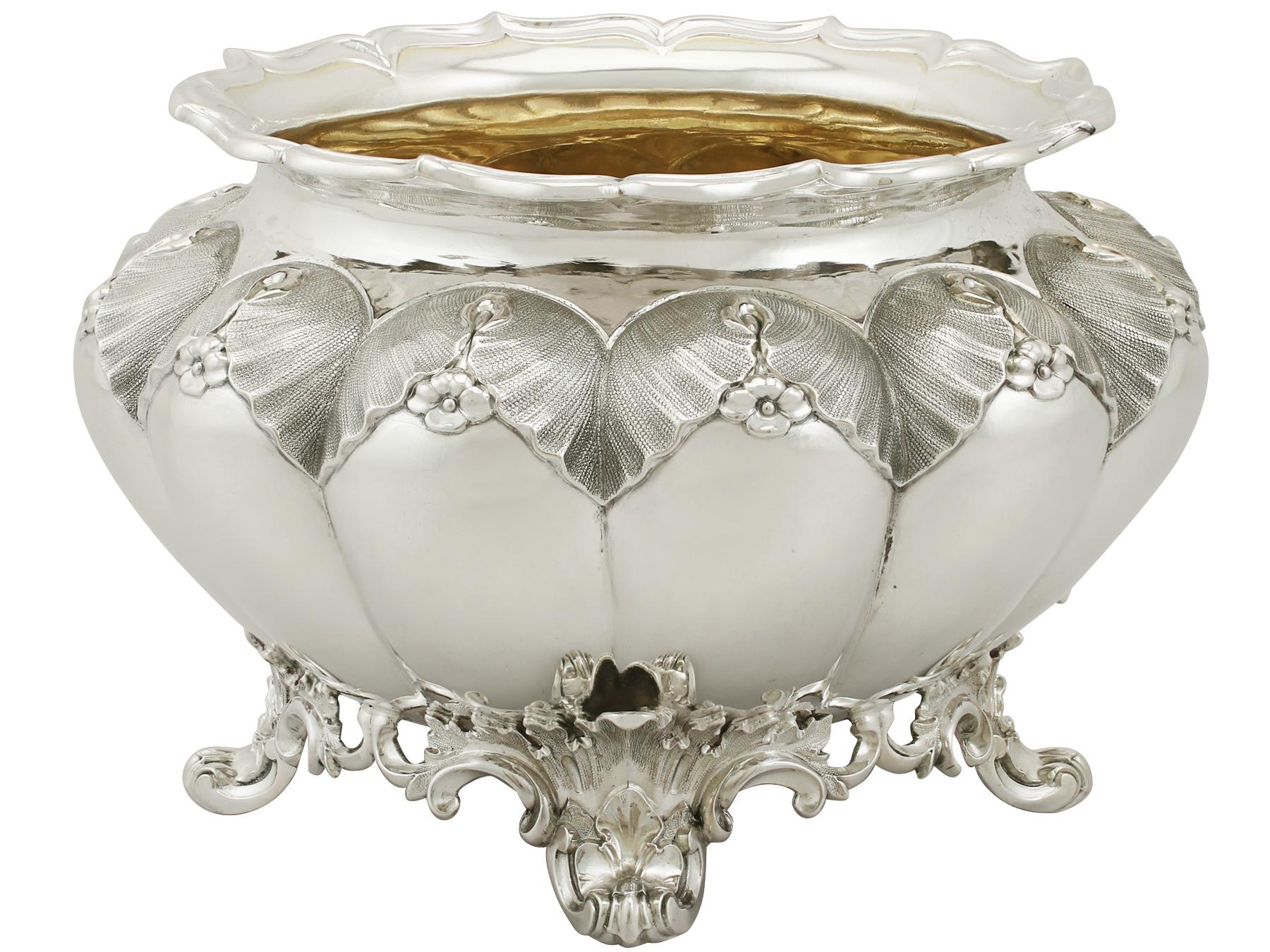 An exceptional, fine and impressive, antique William IV English sterling silver slop bowl; an addition to our silver teaware collection.
This exceptional antique William IV sterling silver slop bowl has circular, lobed form.

The convex paneled
