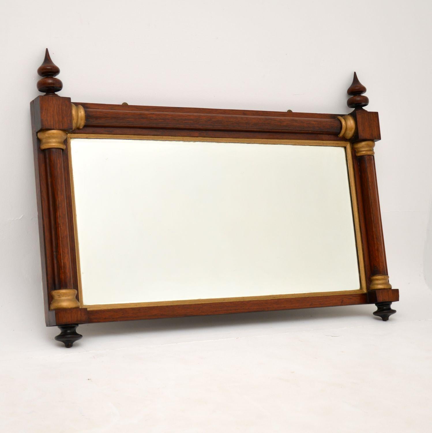 A gorgeous antique William IV period over mantle mirror, dating from around the 1830-40 period.

The quality is amazing, with a stunning solid wood frame embellished with a gilt inner border and gilt corners. It still has all the original finials,