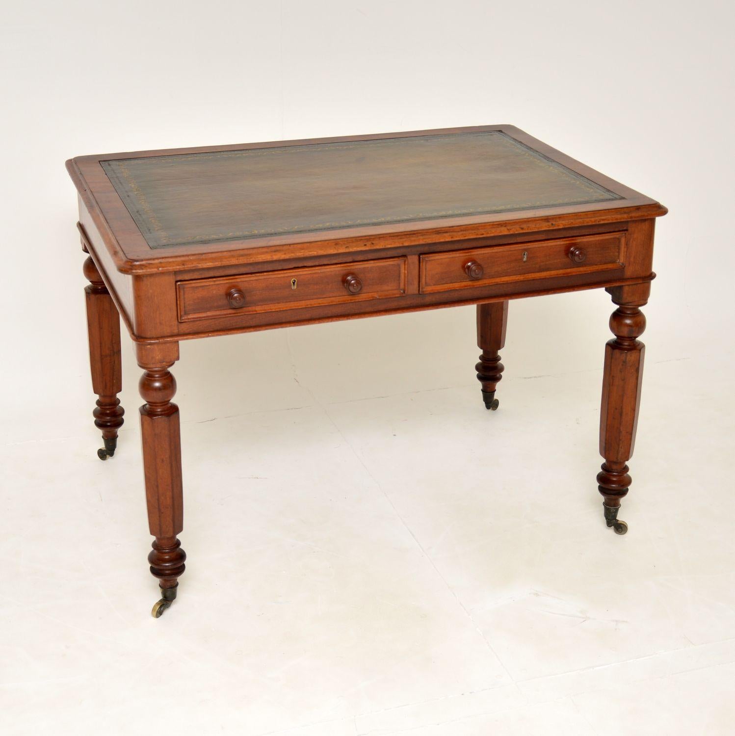 An excellent original antique William IV writing desk. This was made in England, it dates from the 1860-1880’s.

The quality is superb, it is a lovely size and this sits on turned octagonal wood legs with original brass casters. The drawers have