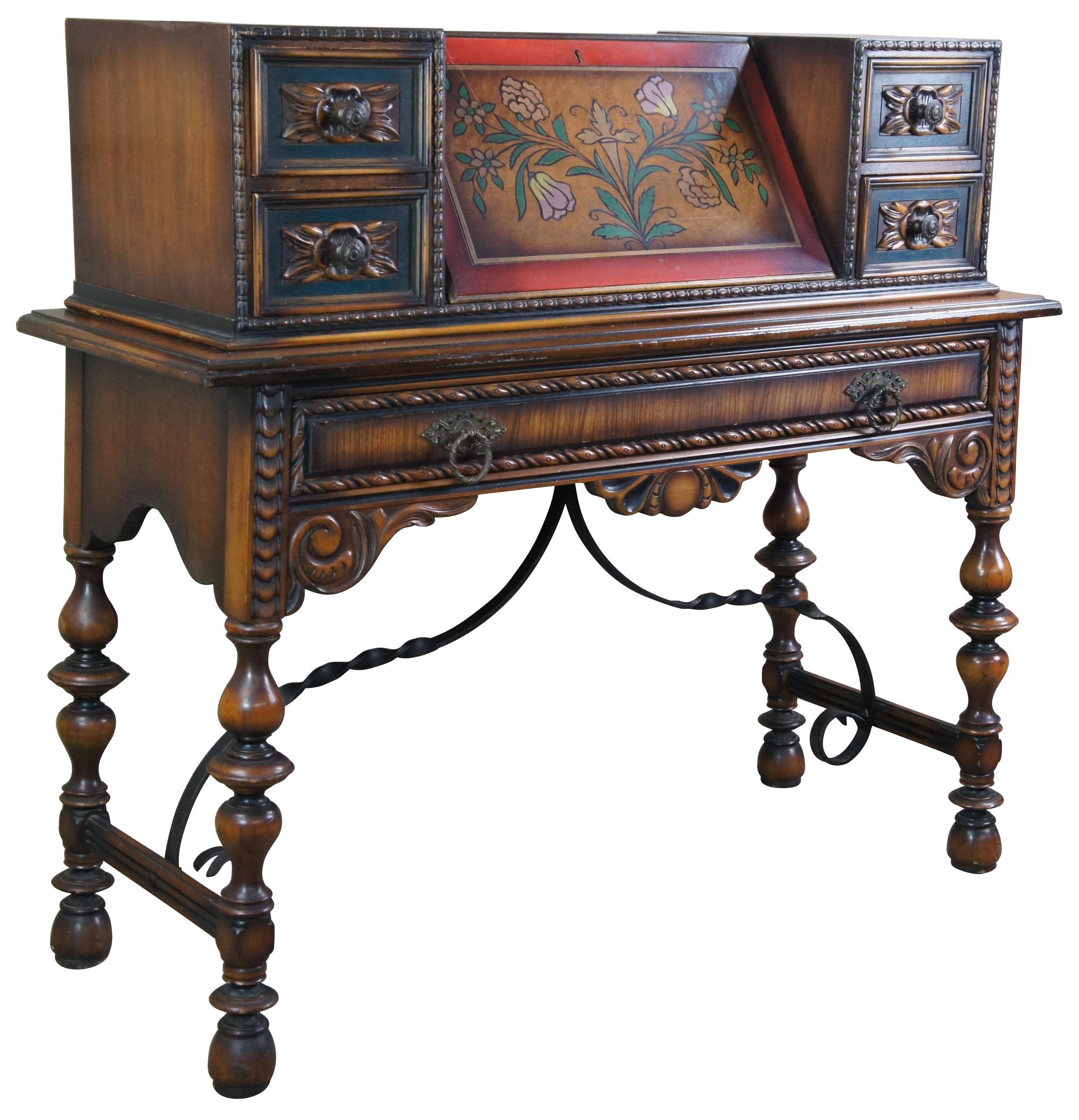 20th Century Jacobean / Spanish Revival secretary desk. Made from walnut with hand carved and painted detail. Features five drawers and interior cubbies for storage. Attributed to Berkey and Gay Furniture Co of Grand Rapids Michigan.

Measures: