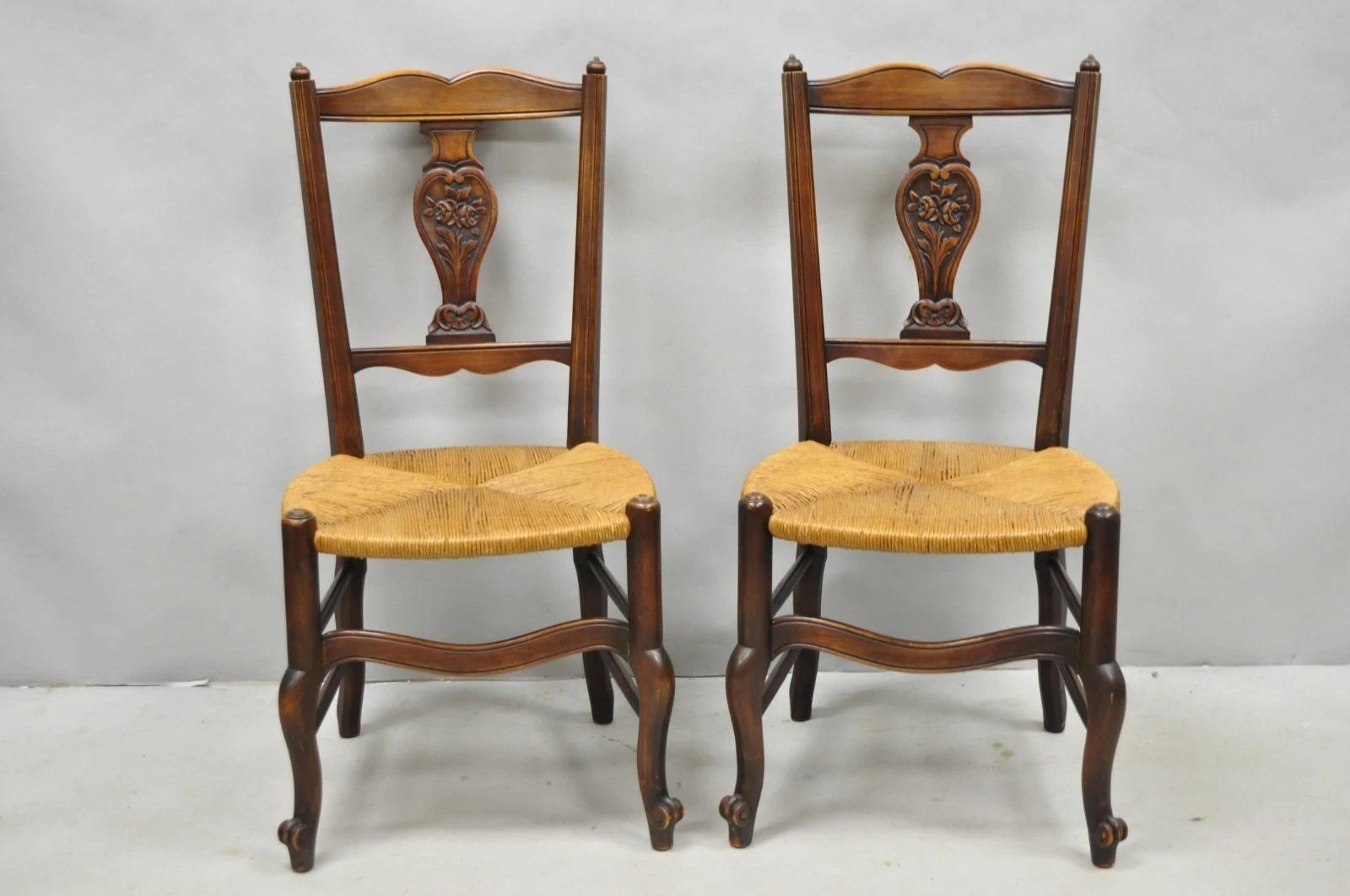 Please message us with your zip code to request a more reasonable domestic U.S. shipping quote.

Antique William & Mary Style Carved Walnut Rose Flower Backsplat Rush Seat Side Chairs - a Pair . Circa Early 20th Century. Measurements: 37.5