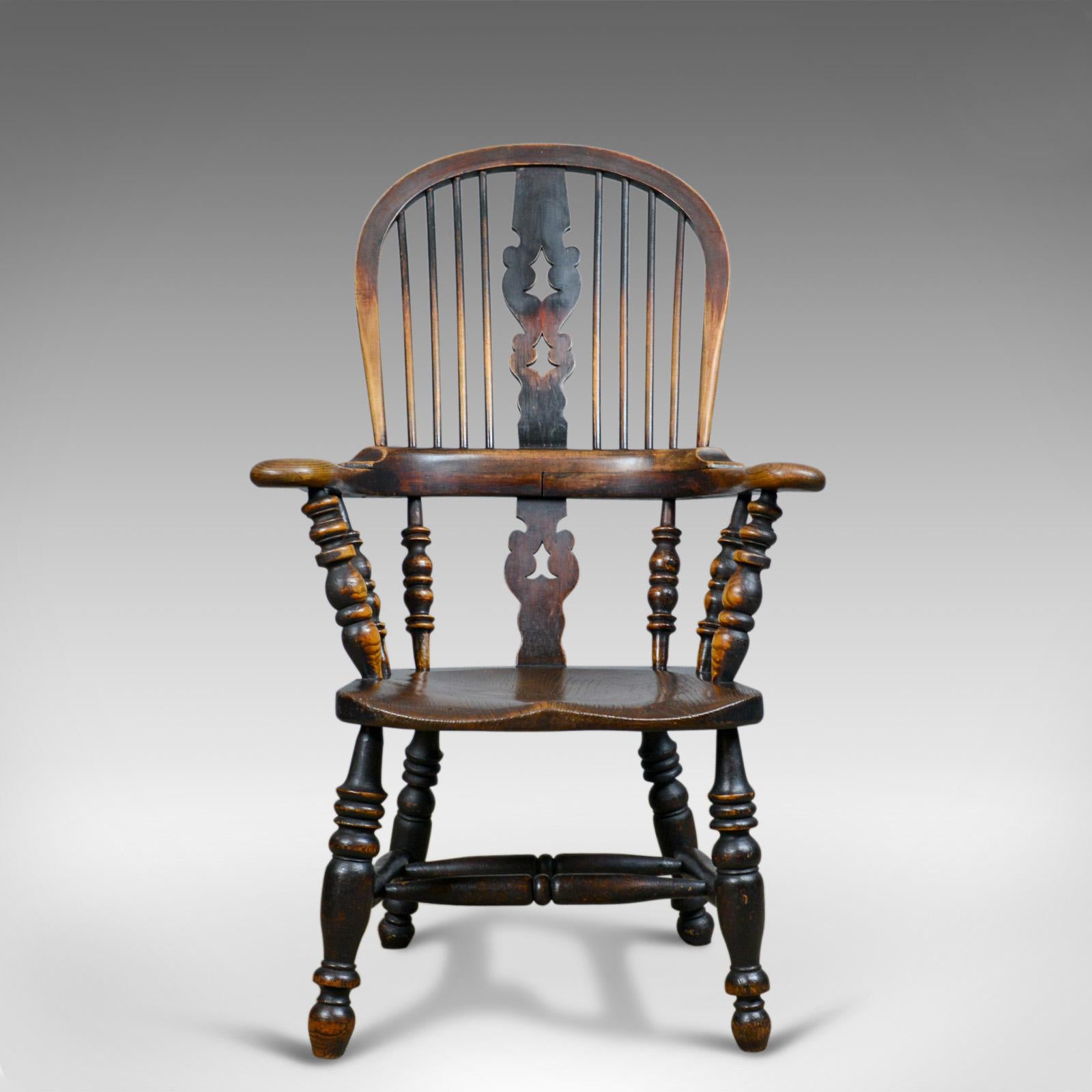 This is an antique Windsor broad arm elbow chair. An English, Yorkshire, Victorian, elm and ash armchair dating to the mid-19th century, circa 1850.

Classic English, country, elbow chair
Delightful color with a desirable aged patina
Triple