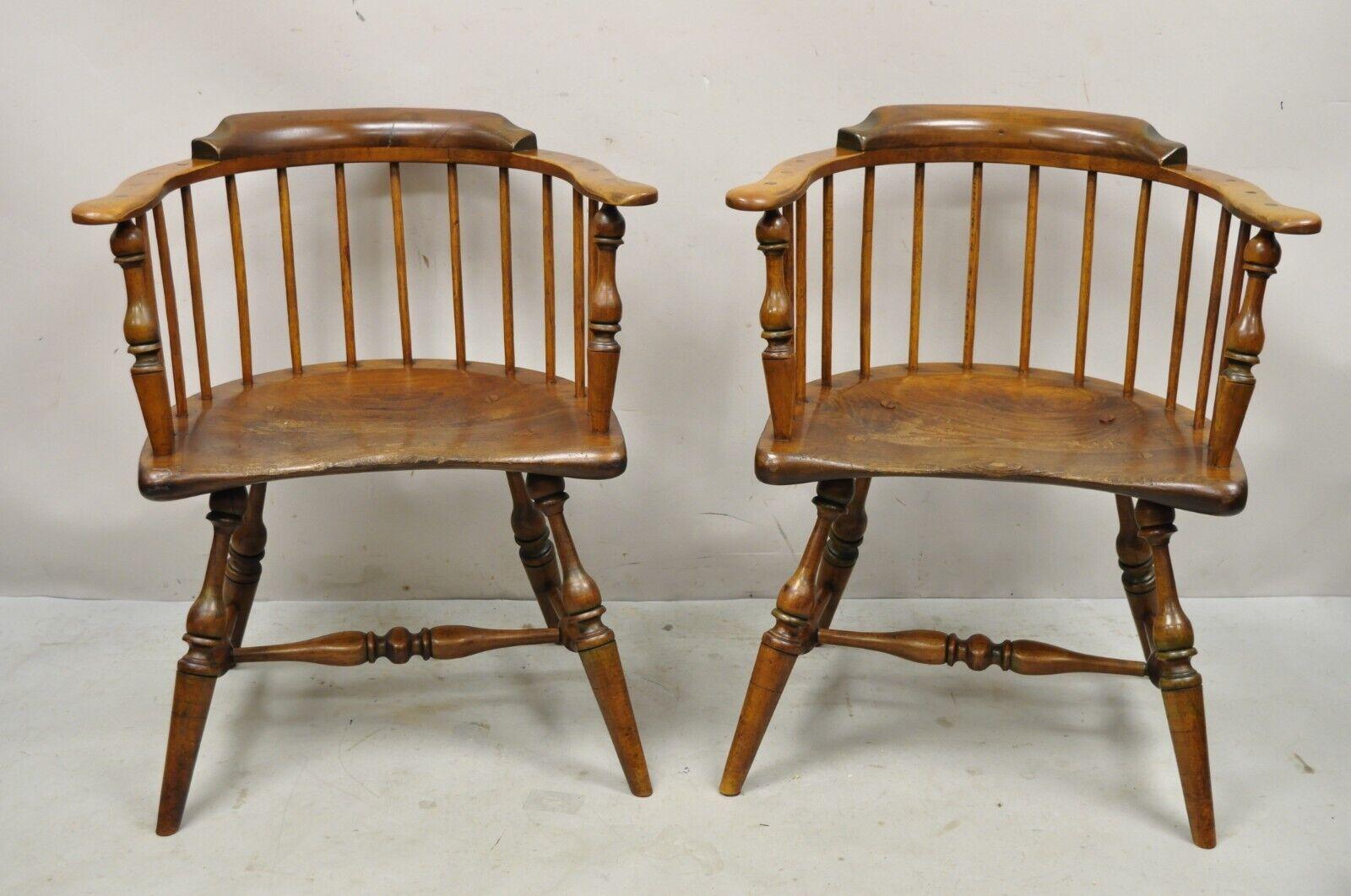 Antique Windsor Colonial style pine wood spindle pub arm chairs - a pair. Item features a carved serpentine plank seat, exposed joints, solid wood frames, beautiful wood grain, distressed finish, very nice antique pair, quality American