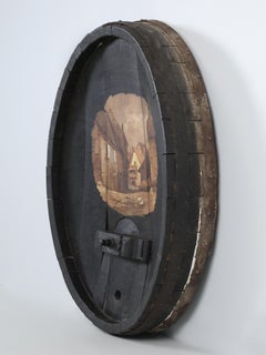 Tapón de barril de vino antiguo reconvertido en arte mural para tu sala de vinos c1800's