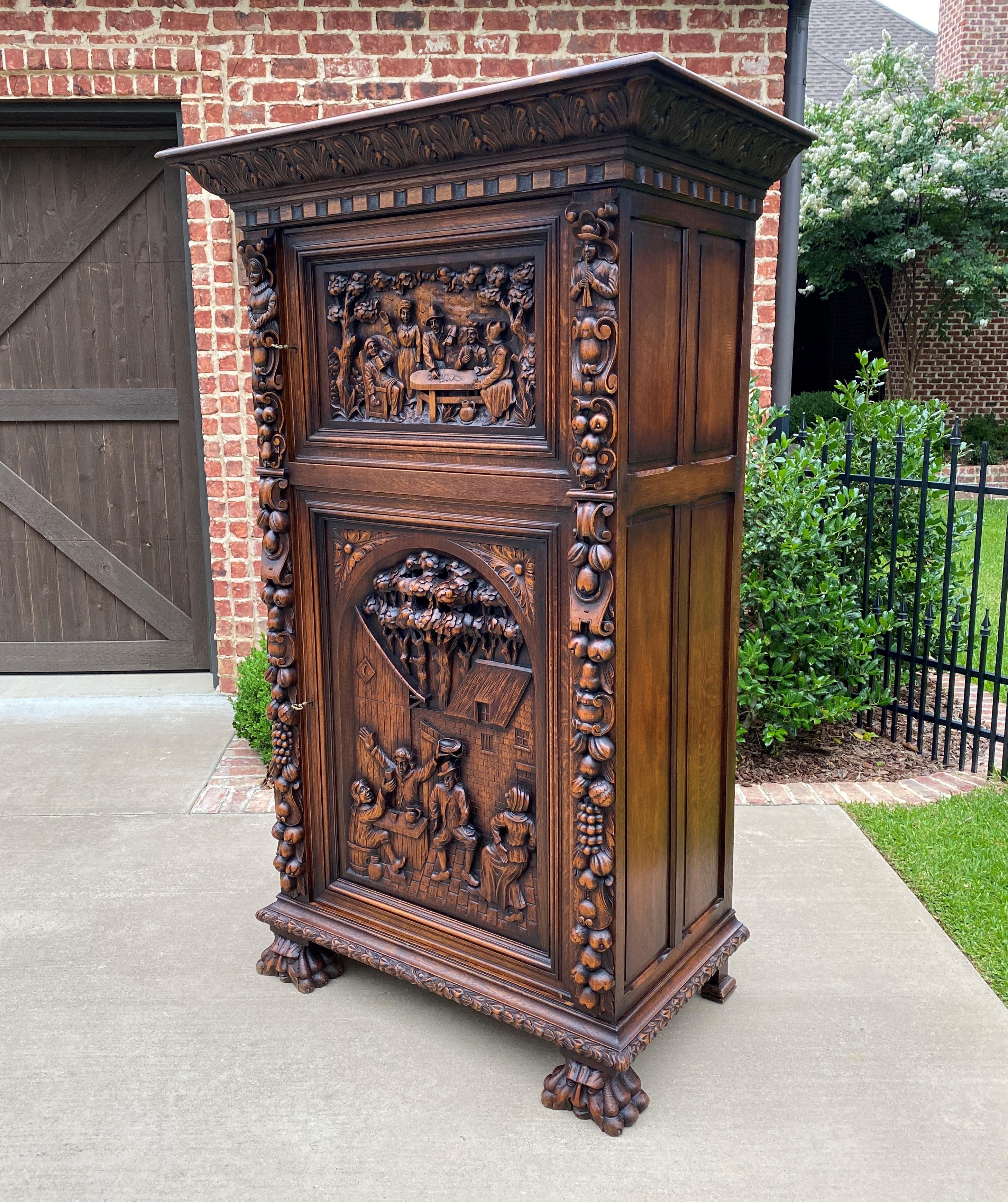 Superb and rare antique Flemish or Belgian Bruegel style oak wine cabinet, storage cabinet, bar, cupboard or armoire~~highly carved~~c. 
1880s 

 SO many versatile uses for today's home

 Use in today's home for storage of linens or towels in a