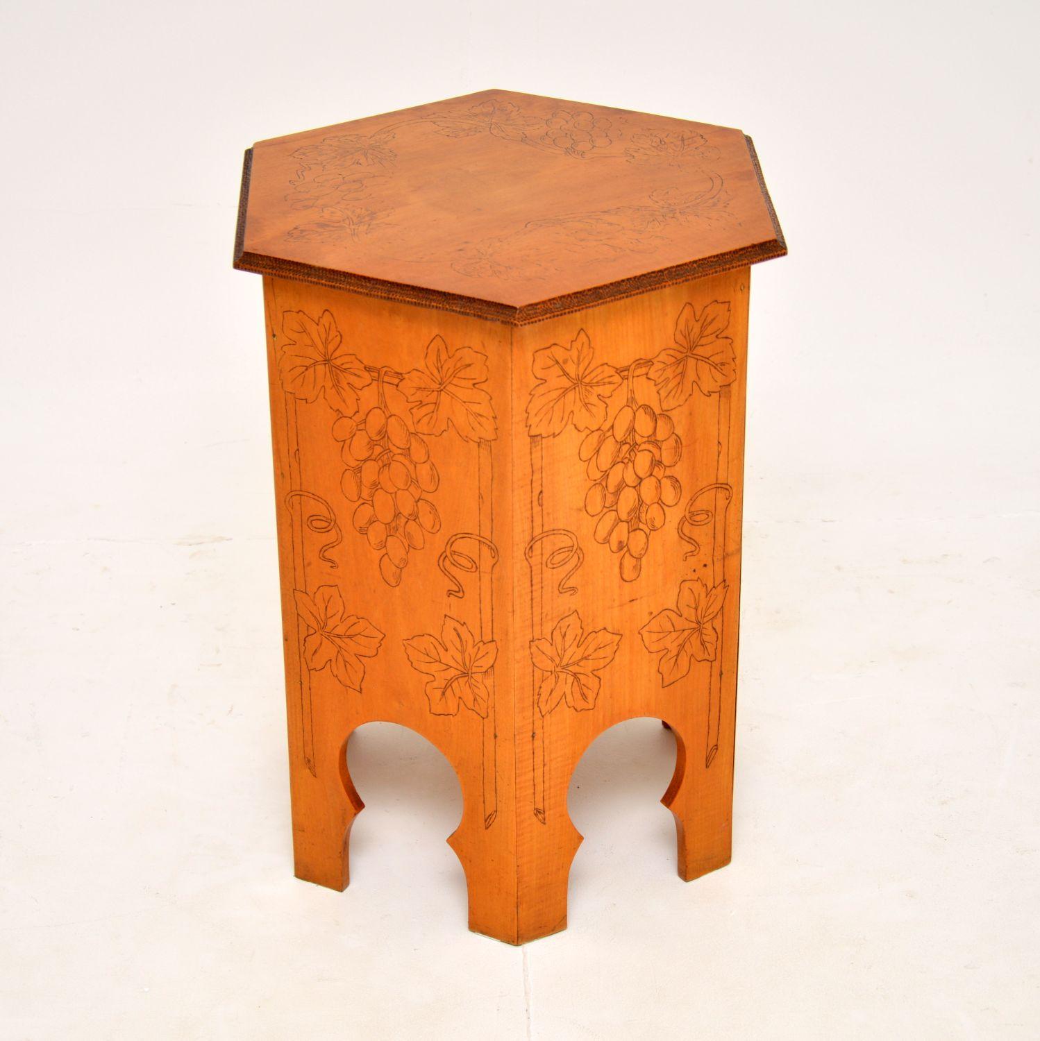 A beautiful and unusual antique wine cooler table with a lift up lid, in solid birch. This was likely made in the 1920’s, it has a typical Moorish influence in the design. It is dated on the bottom, 4/7/28.

It has a gorgeous shape and is a useful