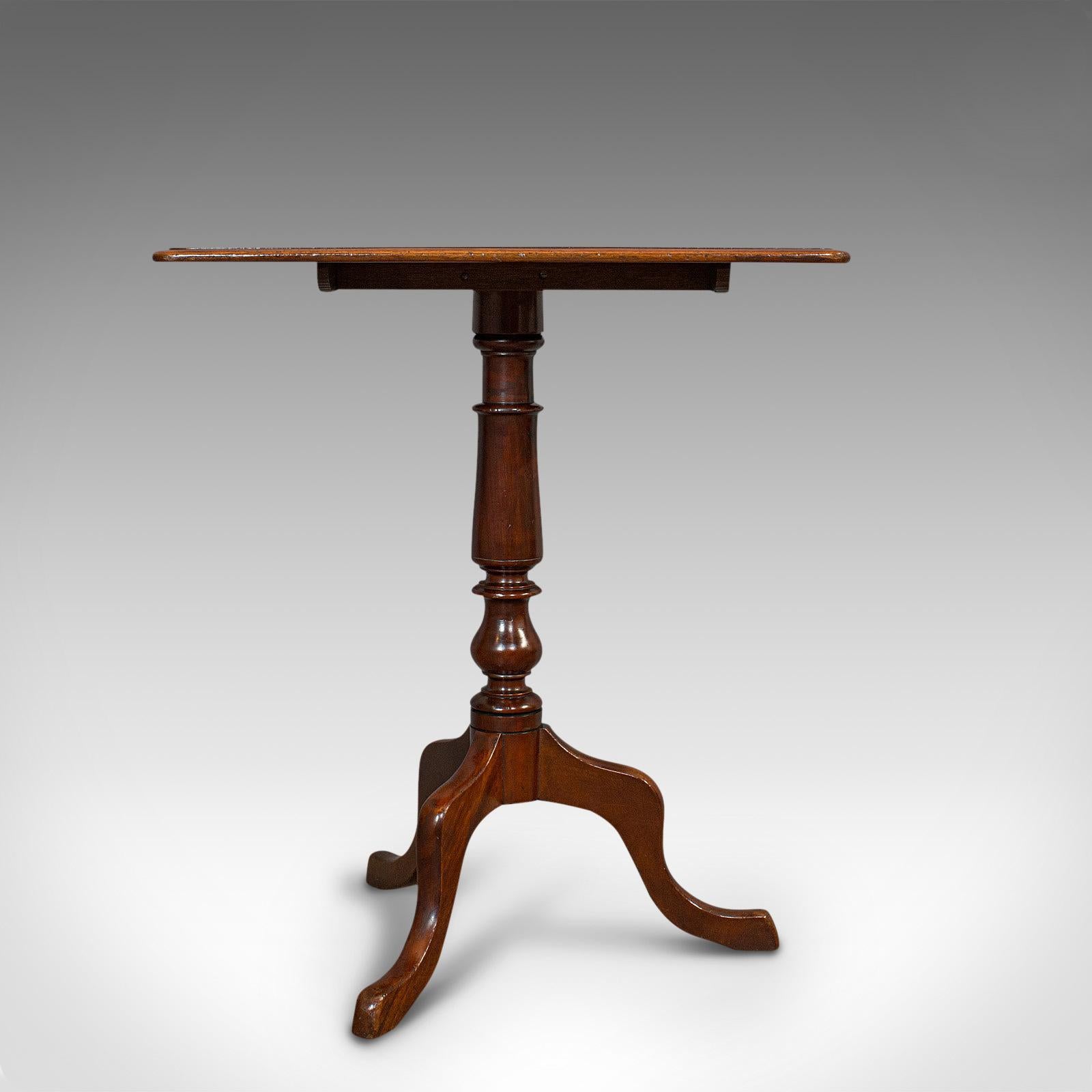 This is an antique wine table. An English, mahogany small side table or lamp stand, dating to the Victorian period, circa 1870.

Sweet, appealing antique wine table
Displays a desirable aged patina
Mahogany shows fine grain interest
Rich russet