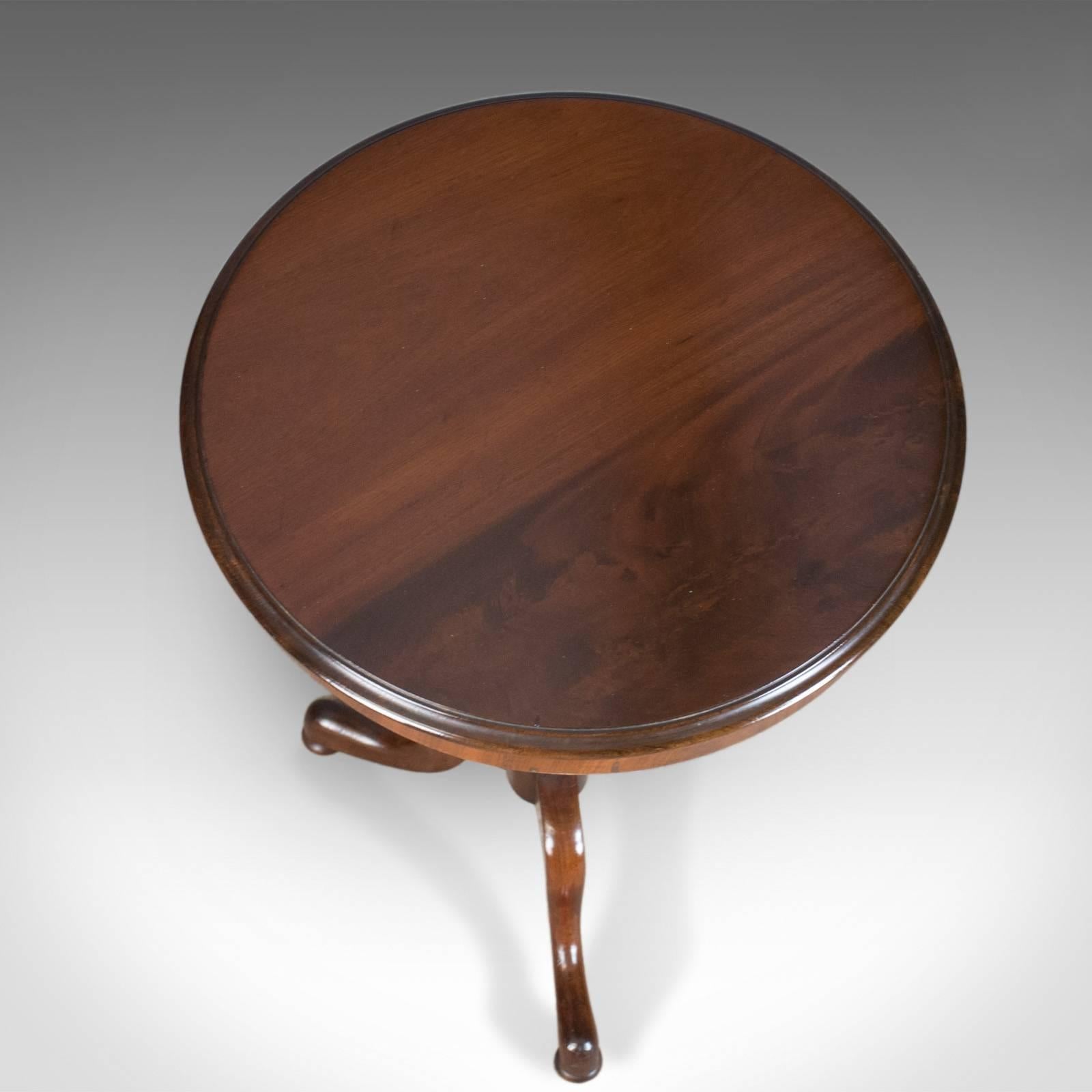 This is an antique wine table, an English, Regency, circular, side table in mahogany dating to circa 1830.

Crafted in select stocks of quality mahogany
Good color and grain interest in a lustrous wax polished finish
Of quality craftsmanship