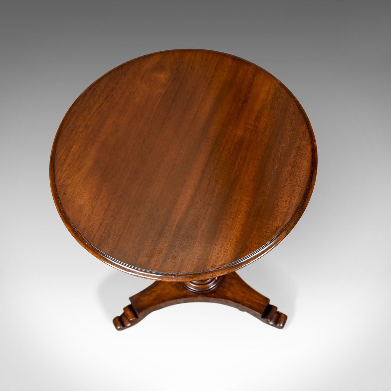 This is an antique wine table, an English, Regency, mahogany tripod side table dating to the early 19th century, circa 1830.

Attractive top, showing quality grain and fine colour
Grain interest and a desirable aged patina
Presented in very good