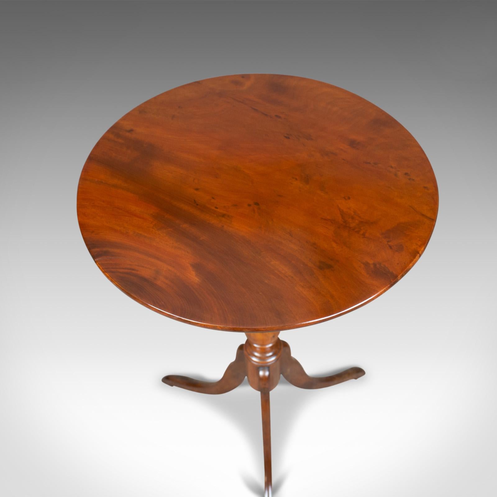 This is an antique wine table, a Regency, circular, side table in mahogany dating to the early 19th century, circa 1820.

Crafted in select stocks of quality mahogany
Good color and grain interest in a lustrous wax polished finish
Of quality