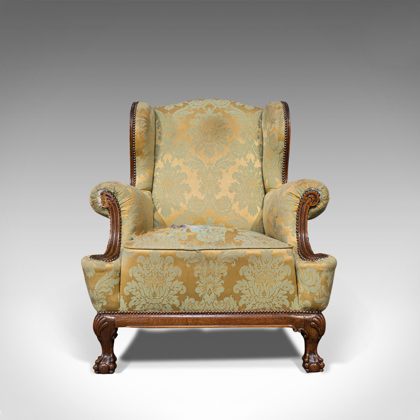 This is an antique wing-back armchair. An English, fireside or lounge seat, dating to the Edwardian period, circa 1910.

An inviting chair, seeks reupholstering to shine
Displays an authentic aged patina, signs of wear and small losses