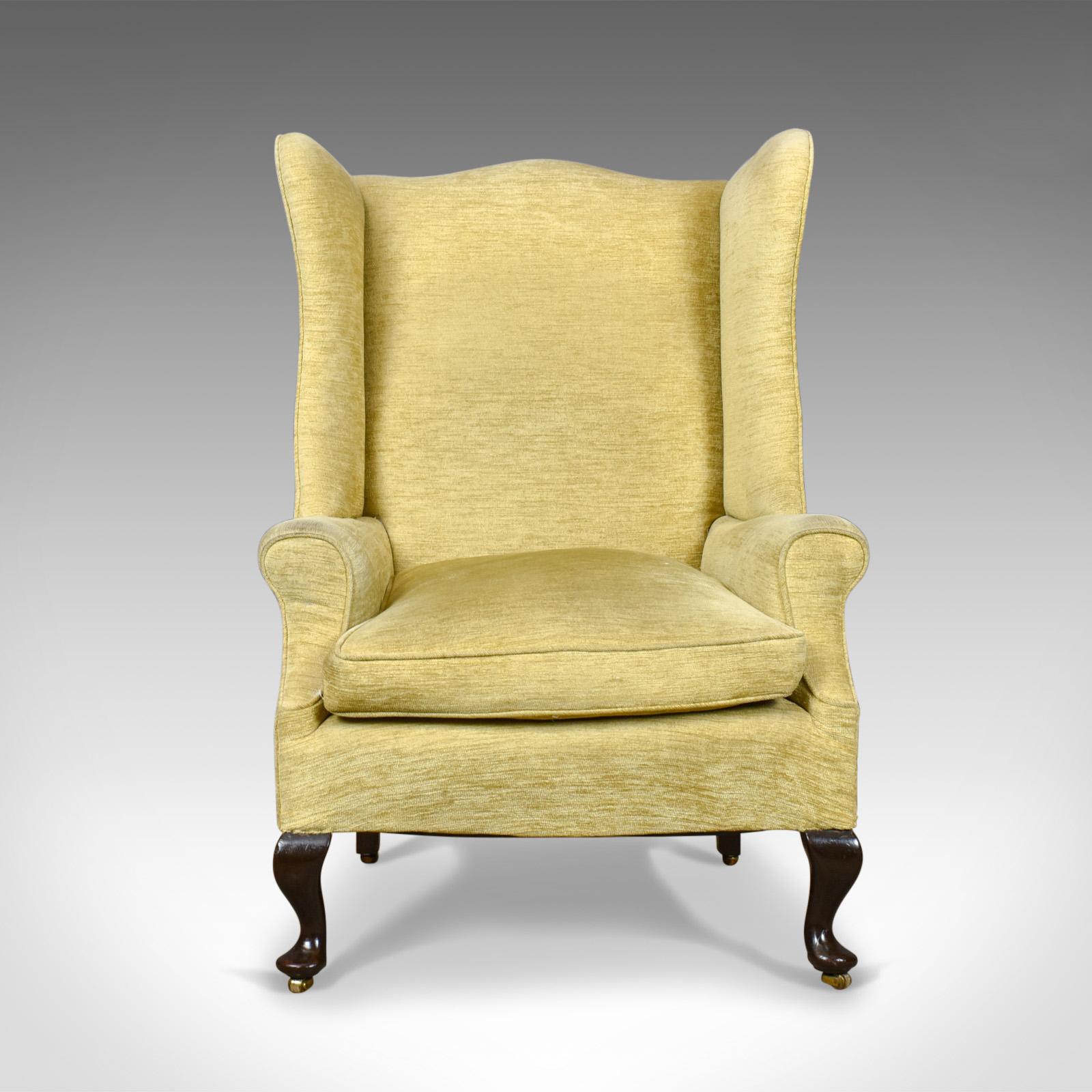 This is an antique wing back armchair, a late Victorian easy chair dating to the turn of the century c.1900.

A large comfortable seat with loose feather filled cushion
Traditionally stuffed and well sprung
Finished in a quality pale, corded