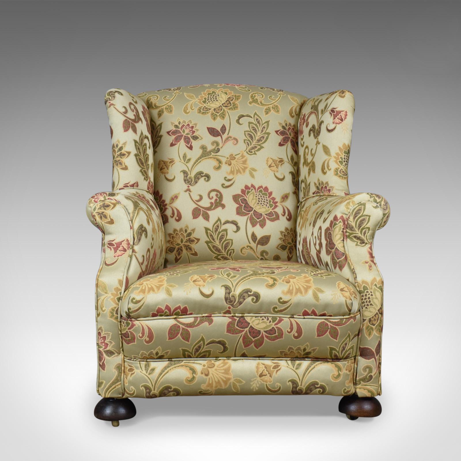 This is an antique wingback armchair. An English, Victorian, deep club chair dating to the end of the 19th century, circa 1900.

Classic proportions offering a broad and comfortable seat
Historically, professionally upholstered in a quality
