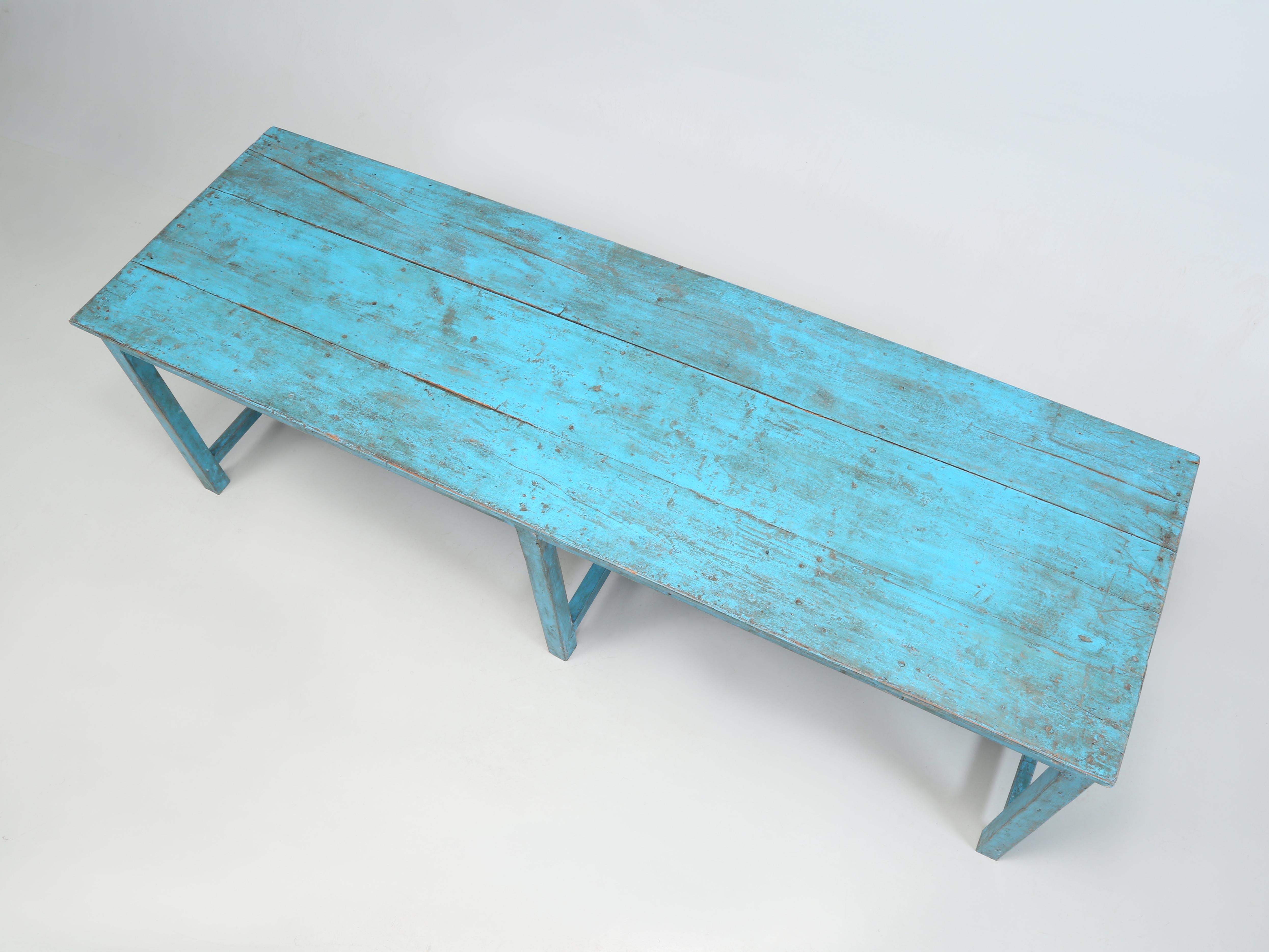Found in Wisconsin is an Old Painted Farm Table in a terrific and unusual shade of blue, which we love. The corners at some point in the past were reinforced with 90-degree steel brackets and we could eliminate them if you like. Finding Genuine Old
