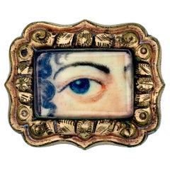 Broche miniature d'antiquité portrait d'une femme avec œil d'amour