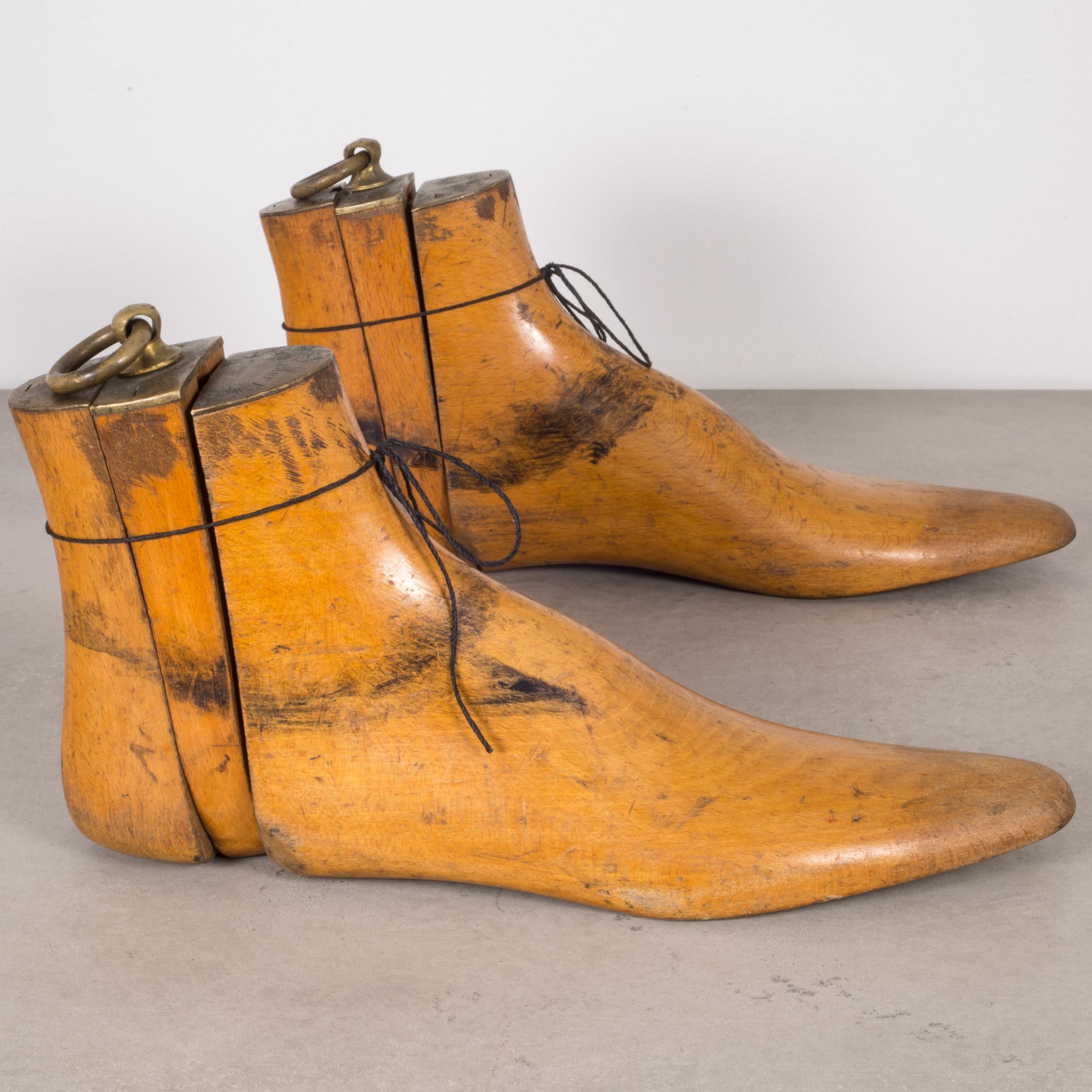 This is an original pair of cobbler's wooden shoe last used to make hand crafted shoes for a certain client. The shoe last were kept at the cobbler's shop for custom shoes when the client requested a pair. These shoe last have the client's name,