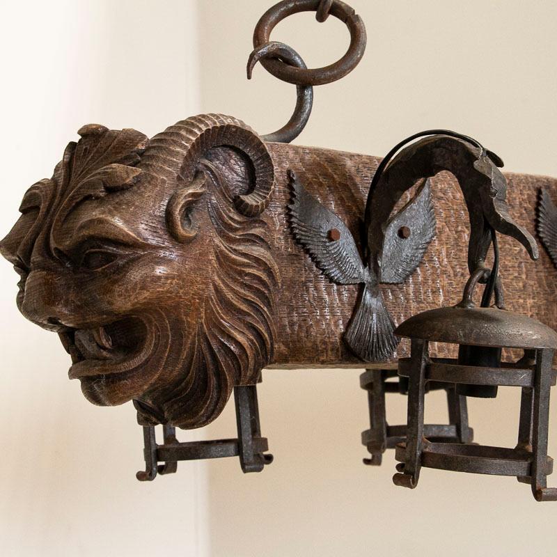 Antique Wood and Wrought Iron Horizontal Chandelier with Carved Gargoyle Heads 1