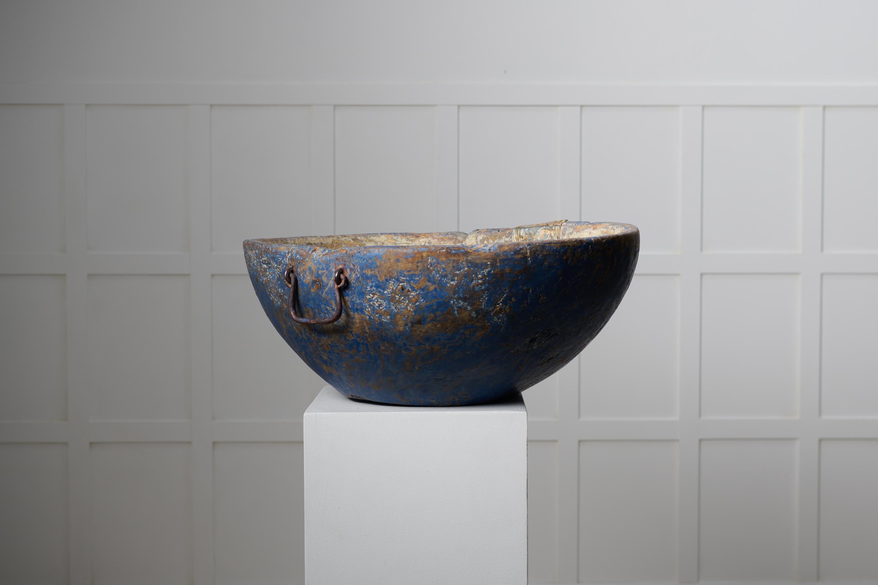Unique unusual wood bowl from northern Sweden. The bowl is large with original blue paint. There is an old repair in tin to one side. The bowl has the authentic patina of a genuine Swedish antique, bowls like this were often used to prepare and