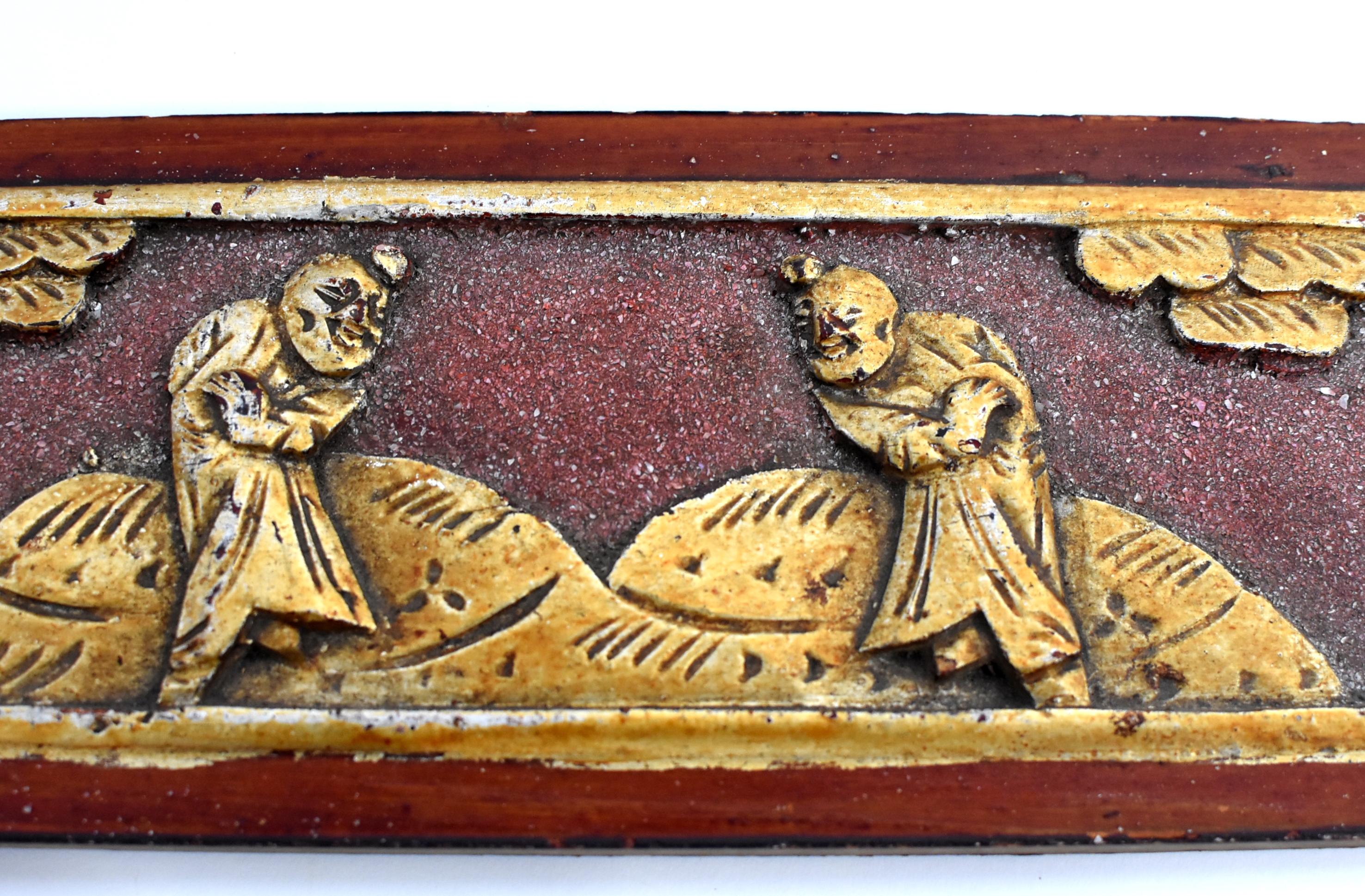 A wonderful set of two 19th century wood carvings, featuring two bothers practicing martial art in the garden. Pine trees symbolize longevity. Original red lacquer with gilding. Mother of pearl encrusted.