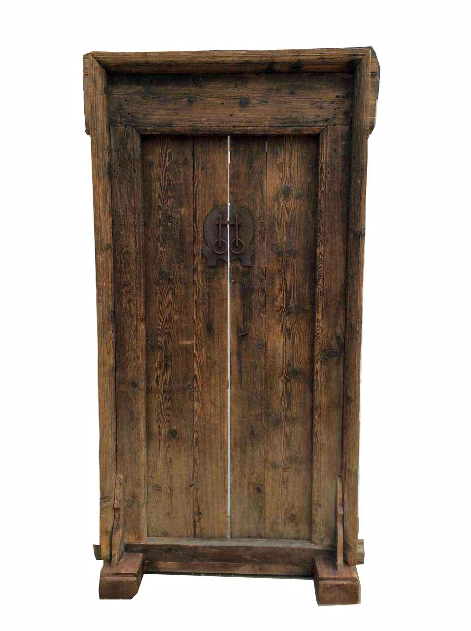 This antique door is in the same condition as it was found in Shanxi, China. Original wood, brassware and complete door frame. Its natural aged wood, wood knots, lines, and cracks add unique characters to this antique door from Far East.