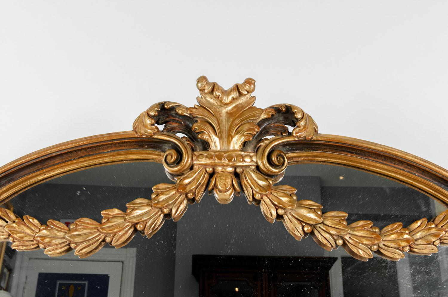 Antique wood framed gilded bevelled hanging wall / fire place / mantel mirror. The mirror is in excellent antique condition. The mirror measure about 60 inches width x 49 inches high.