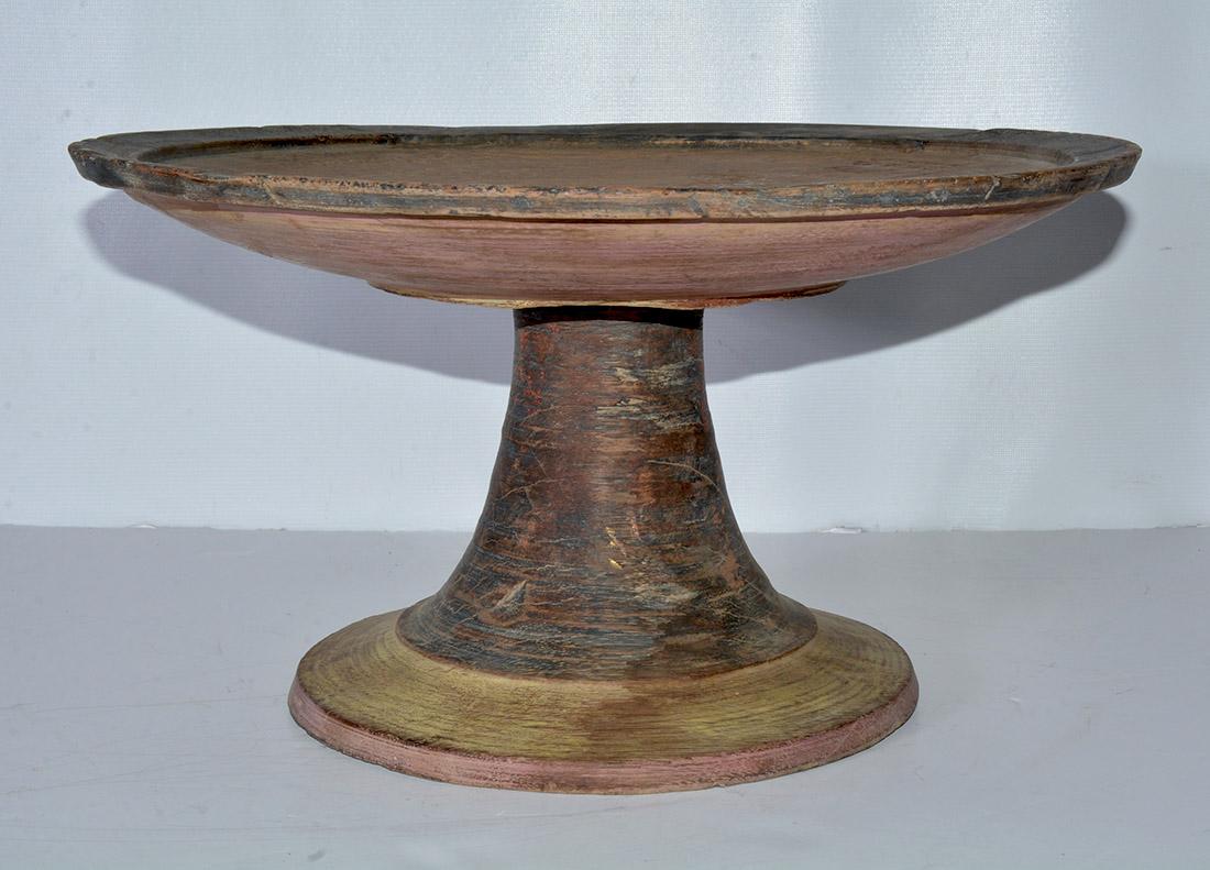 The antique wood pedestal display stand was carefully hand-crafted on a lathe from a single log. A magnificent and unique wood base for a three-dimensional work of art or for serving round platters of food, fruit or a cake, etc.
Cake stand.