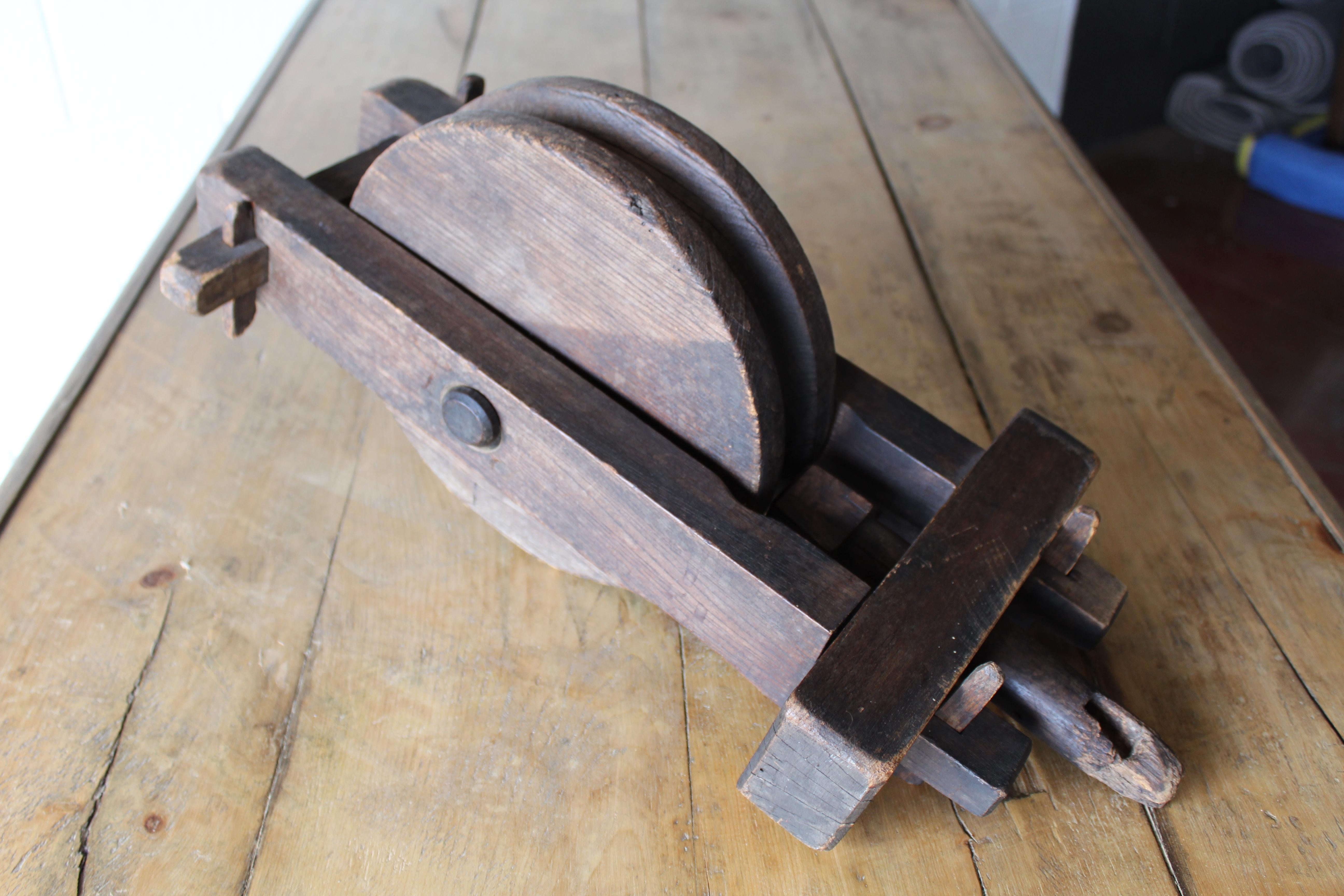 Antique English wood pulley.