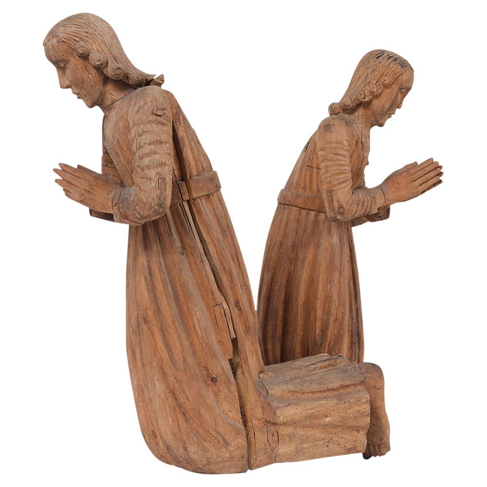 An extraordinary late 18th century santos praying sculptures are hand-crafted and have detailed carved designs. These antique santos show signs of wear from age and use and are ready to be used for years to come.
