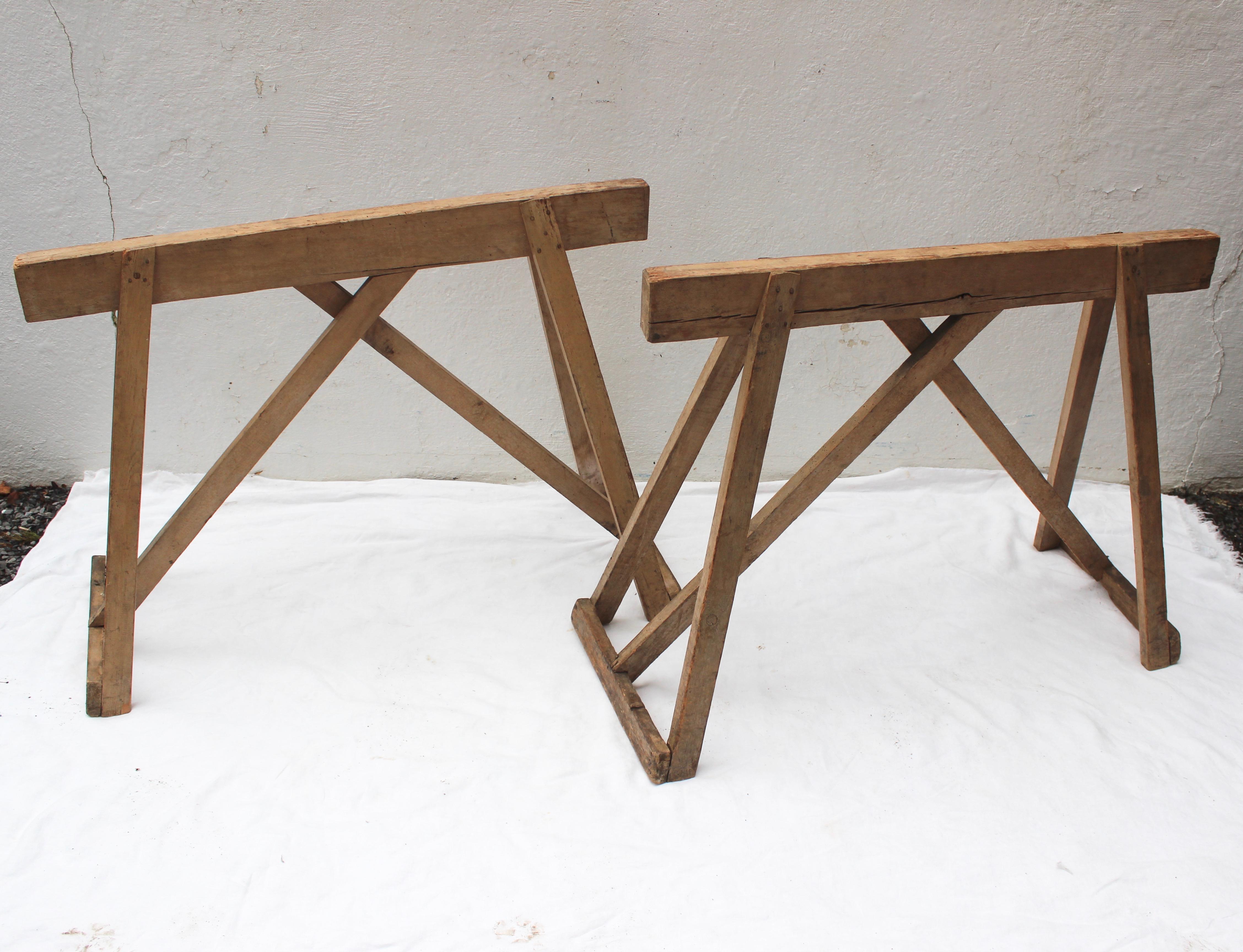 Antique wood saw horse table bases.