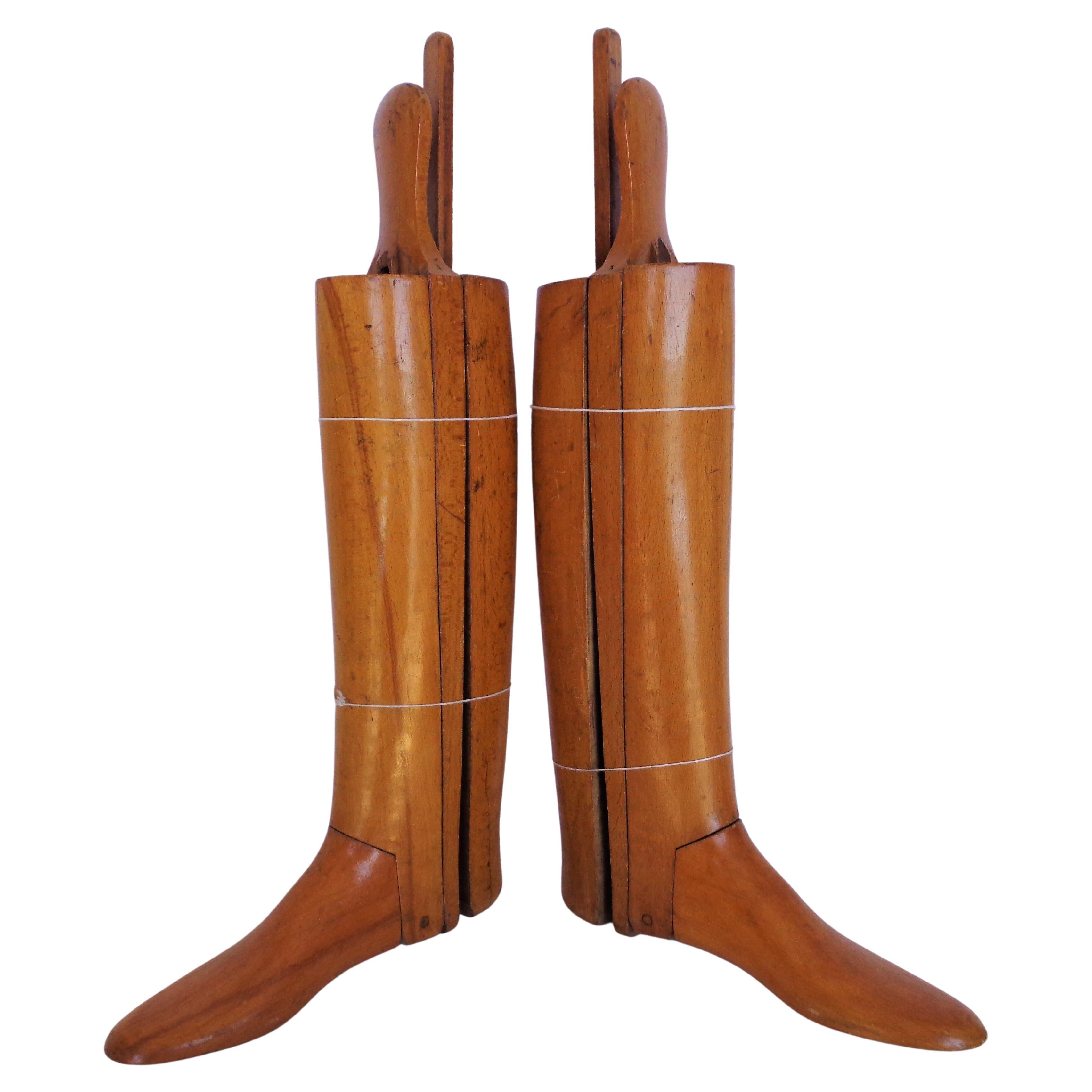 Pair of fine quality antique wood tree stretchers for English leather horse riding boots with pegged articulated construction in overall beautifully aged original glowing honey color. Stamped signed left and right, numbered 905. Look at all pictures