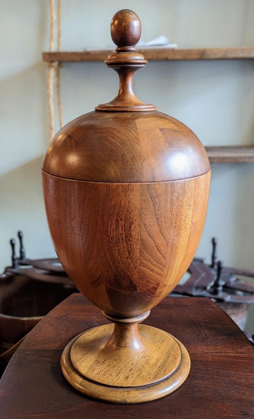 Beautifully shaped antique wood cutlery urn, with acorn shaped finials which help when lifting the lid. Exceptional Size, measures 22 inches tall by 10 inches in total width. Has two interior fittings with slots for inserting cutlery. Slight wear as