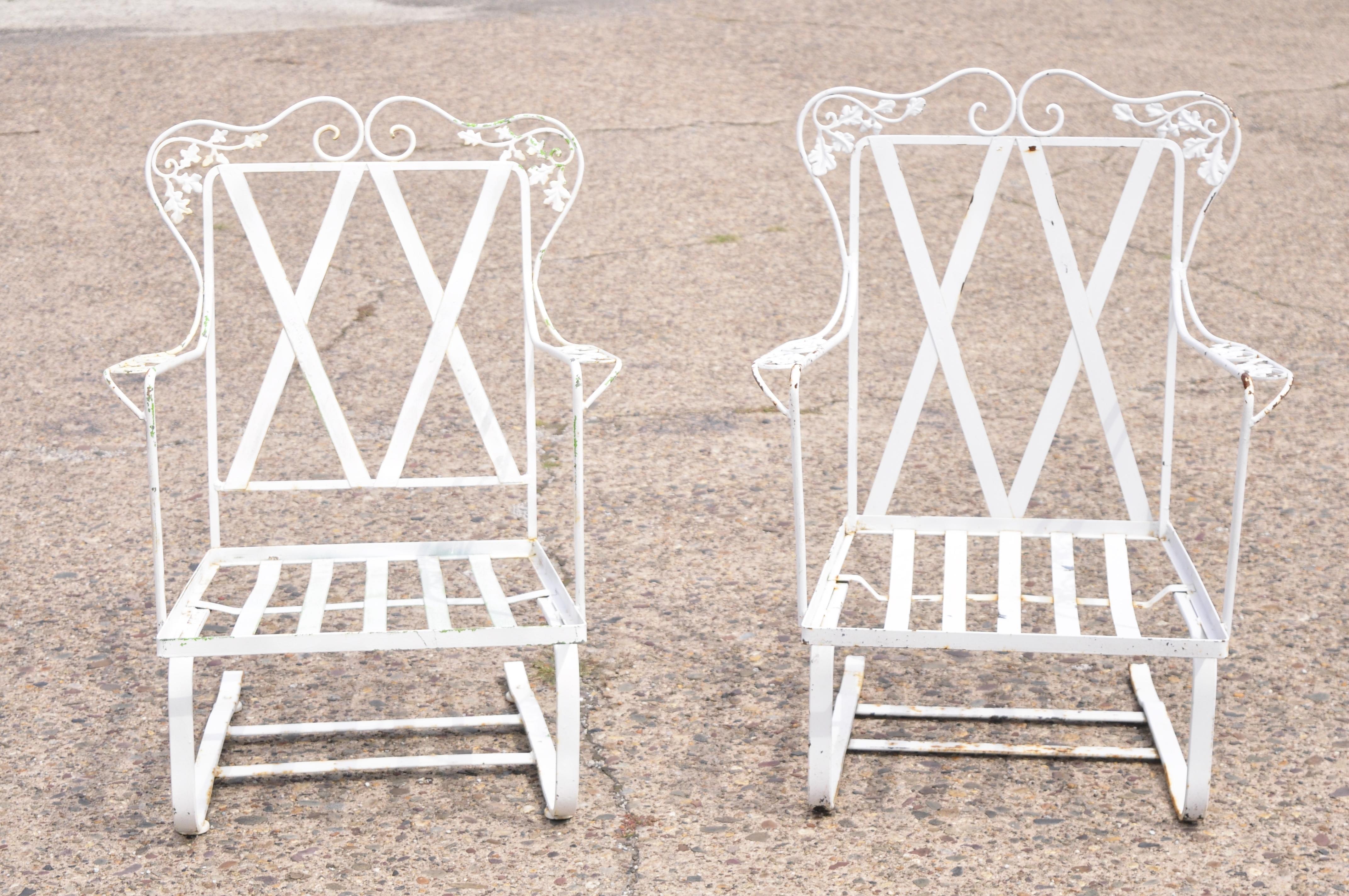 Antique Woodard Chantilly rose wrought iron garden patio bouncer lounge chair, a pair. Item features his and her frames (one chair slightly bigger), classic Chantilly rose pattern, wrought iron construction, original label, very nice vintage pair,