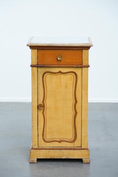 Antique wooden 1-door hallway/nightstand with a light marble top