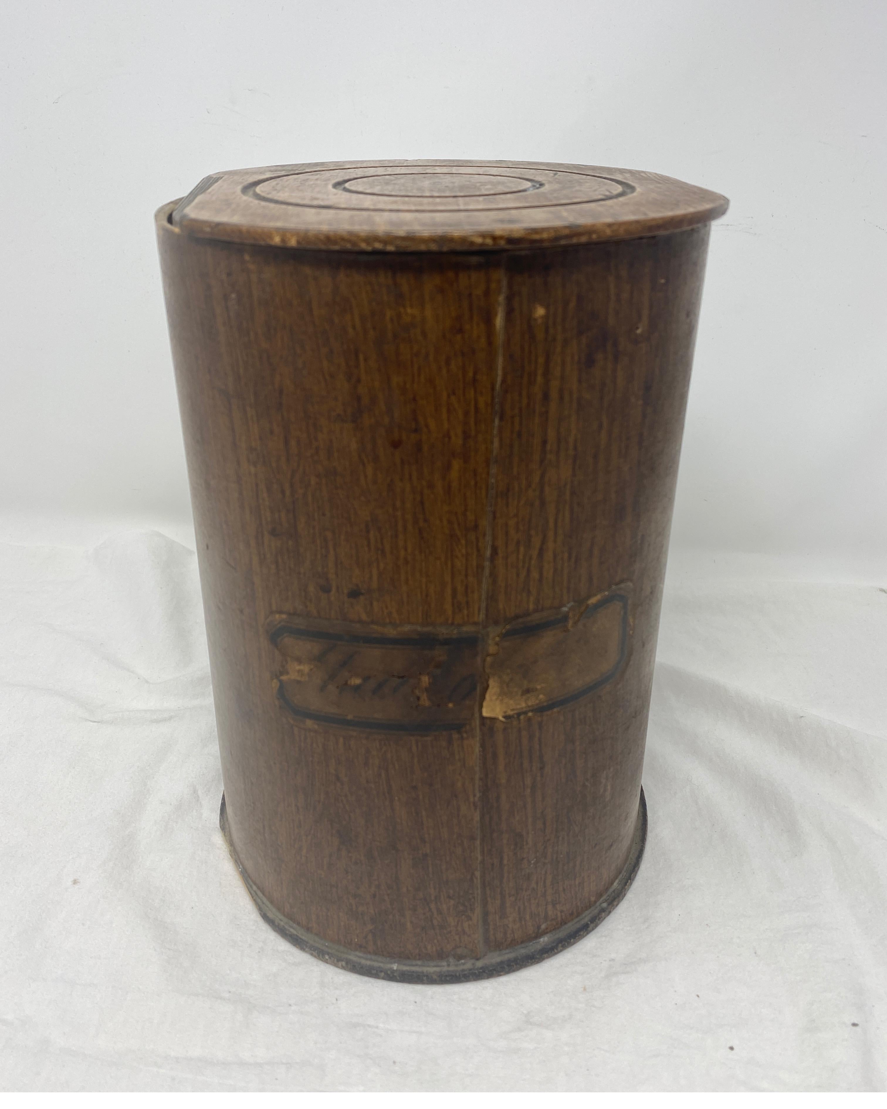 Antique wooden apothecary Pharmacy storage jars with lid. A large 9 inch wood and fiberboard apothecary jar or canister. With a paper label. The top and bottom are made of wood, and the sides are a heavy fiberboard, with a faux wood paper finish.