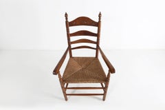 Antique wooden armchair with cane seat, France ca. 1900