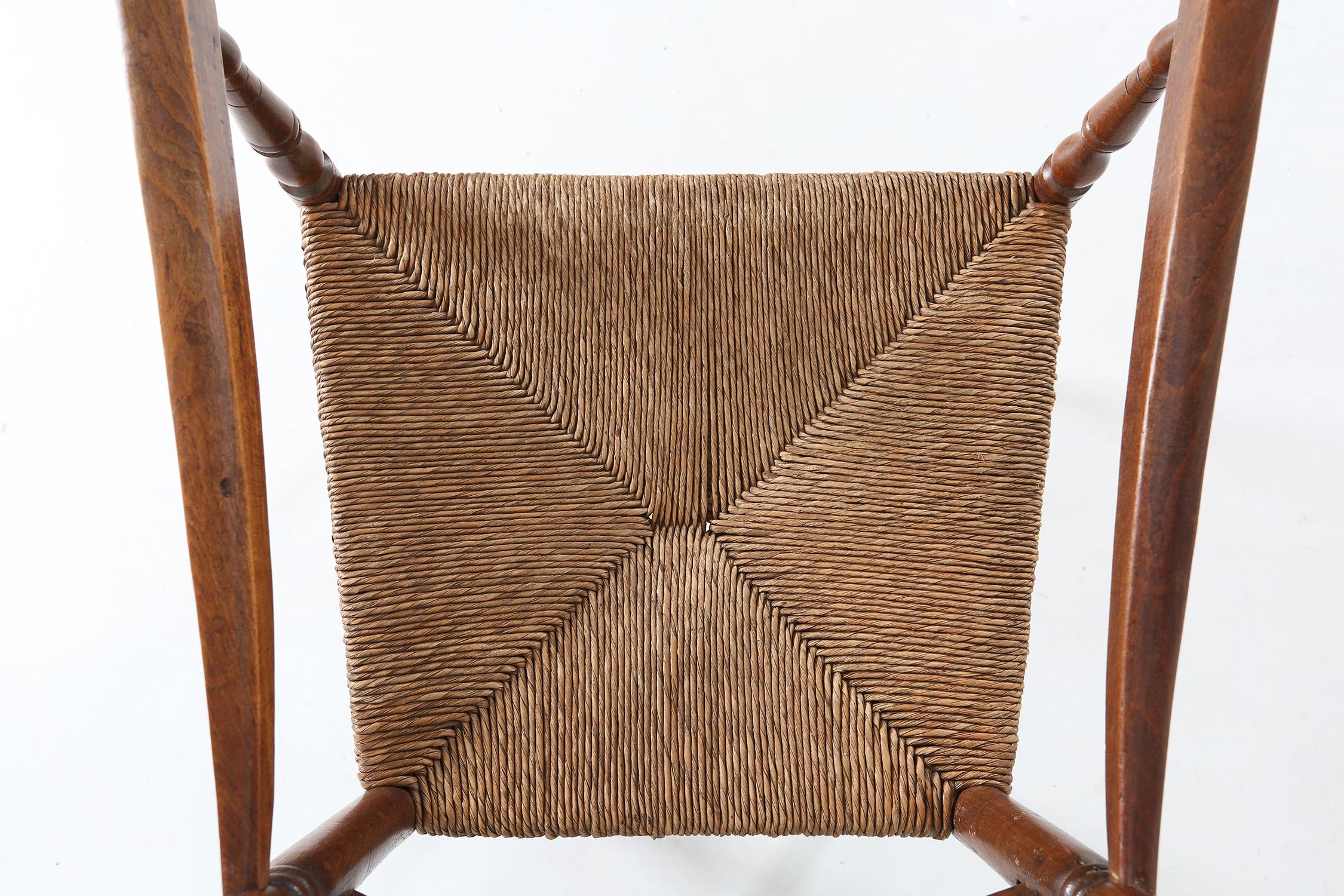 Rustic Antique wooden armchair with cane seat, France ca. 1900 For Sale