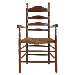 Antique wooden armchair with cane seat, France ca. 1900