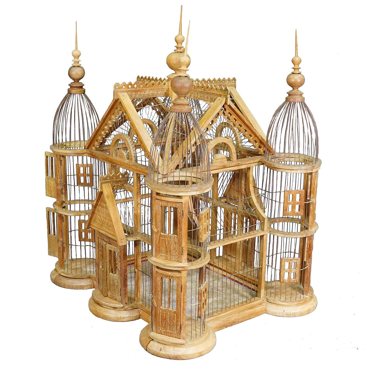 Antique Wooden Bird Cage Handmade in Germany ca. 1920s

A beautiful, handcrafted bird cage in the shape of a Victorian nobleman's house. It has 4 towers, each with 2 doors and attached windows. Double doors are attached to the front and back. The