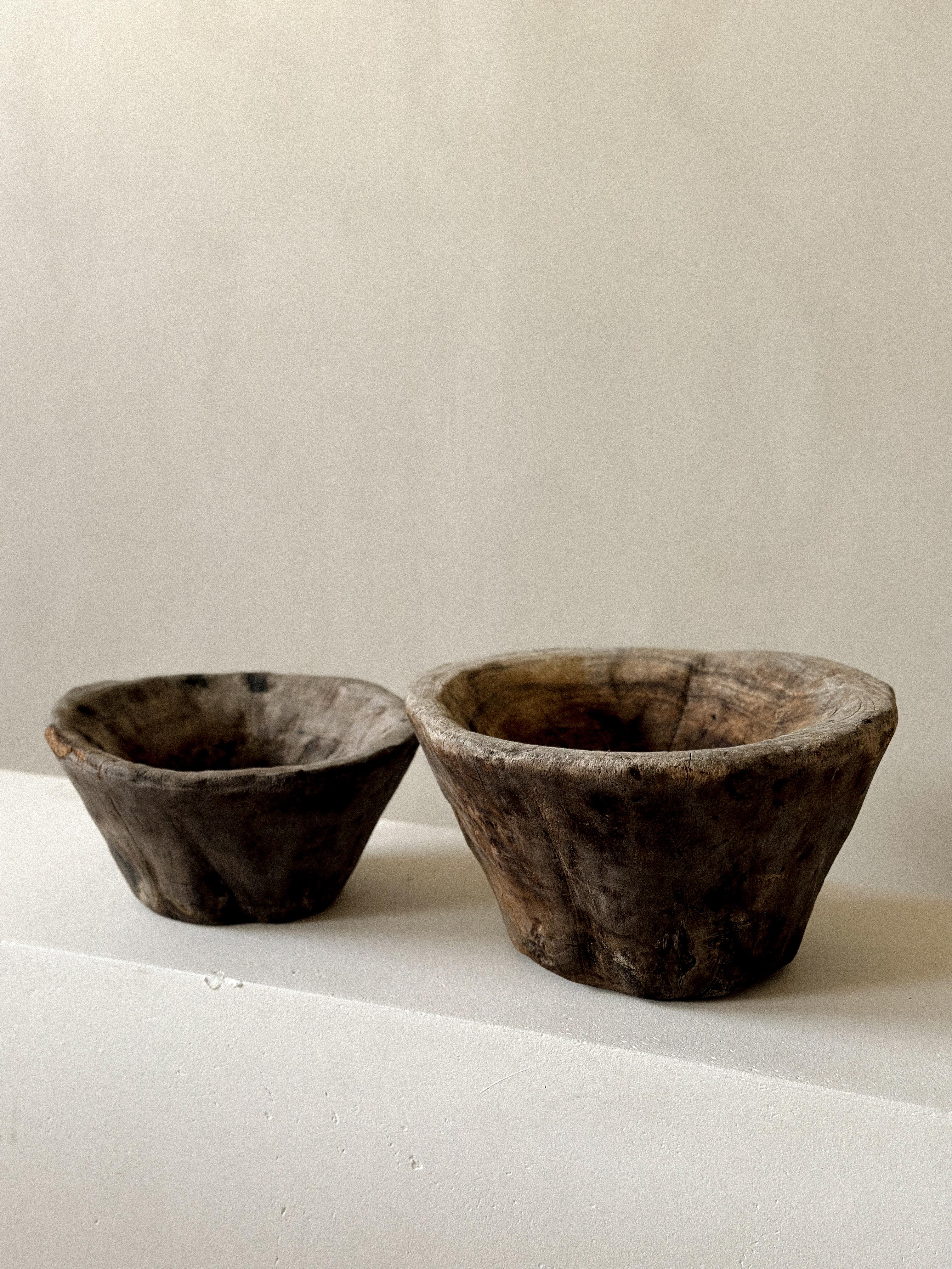 A set of two wooden Wabi Sabi bowls from Scandinavia, circa 1800s. In good vintage condition showing beautiful patina from age and use.

Lagerst bowl: Ø34 cm, H: 19 cm 
Smallest bowl: Ø: 28 cm, H: 14 cm 