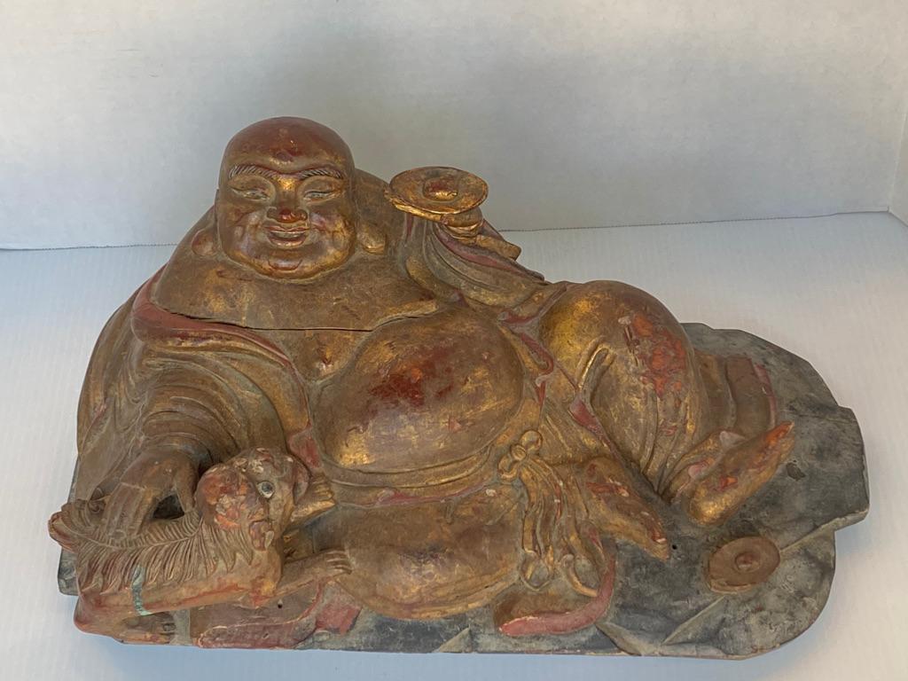 This large hand carved reclined Hotei “God of Happiness
