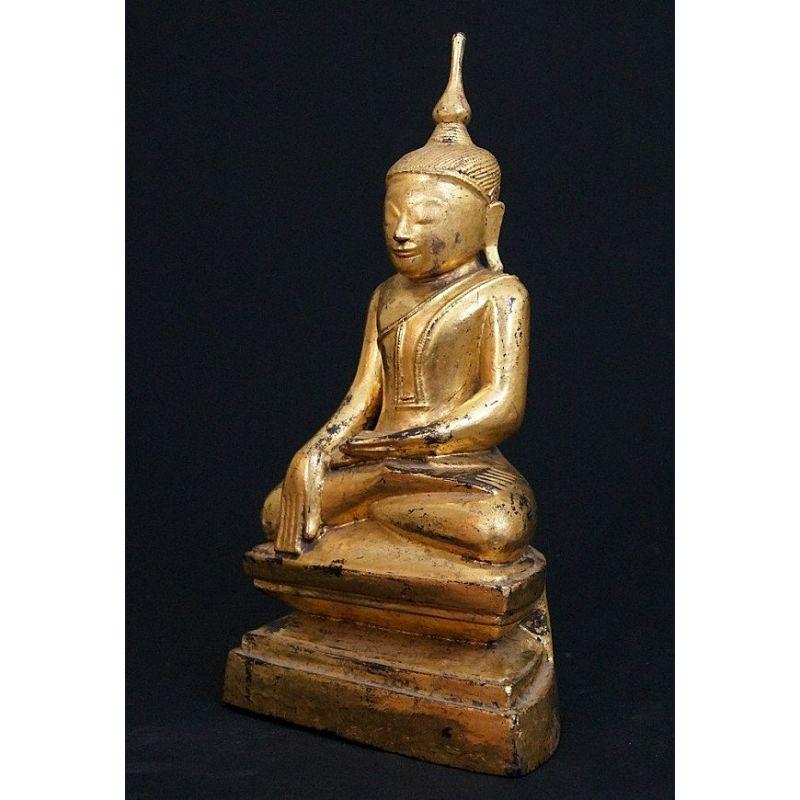 Material: wood
40 cm high 
Weight: 2.058 kgs
Shan (Tai Yai) style
Bhumisparsha mudra
Originating from Burma
19th century
Gilt with 24 krt. gold leaf

