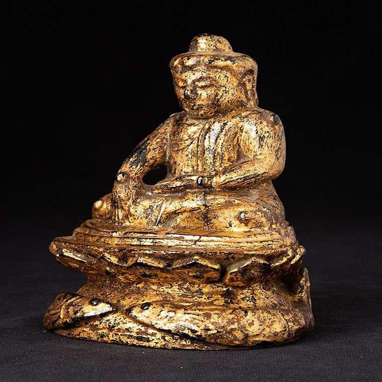 Material: wood
13,7 cm high 
9,7 cm wide and 7,5 cm deep
Weight: 0.251 kgs
Gilded with 24 krt. gold
Bhumisparsha mudra
Originating from Burma
Early 19th century
With hollow space in the backside of the base.