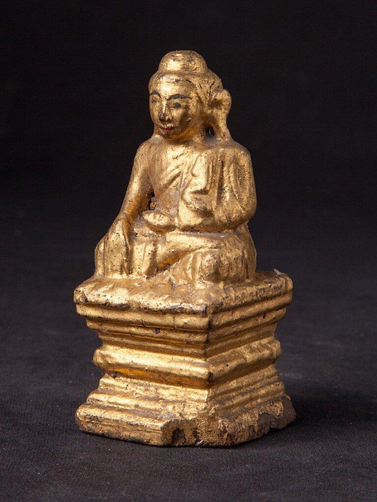 Material: wood
9,5 cm high 
4,2 cm wide and 4,2 cm deep
Weight: 0.039 kgs
Gilded with 24 krt. gold
Bhumisparsha mudra
Originating from Burma
19th century.
 
