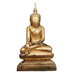 Antica statua di Buddha in legno proveniente dalla Birmania