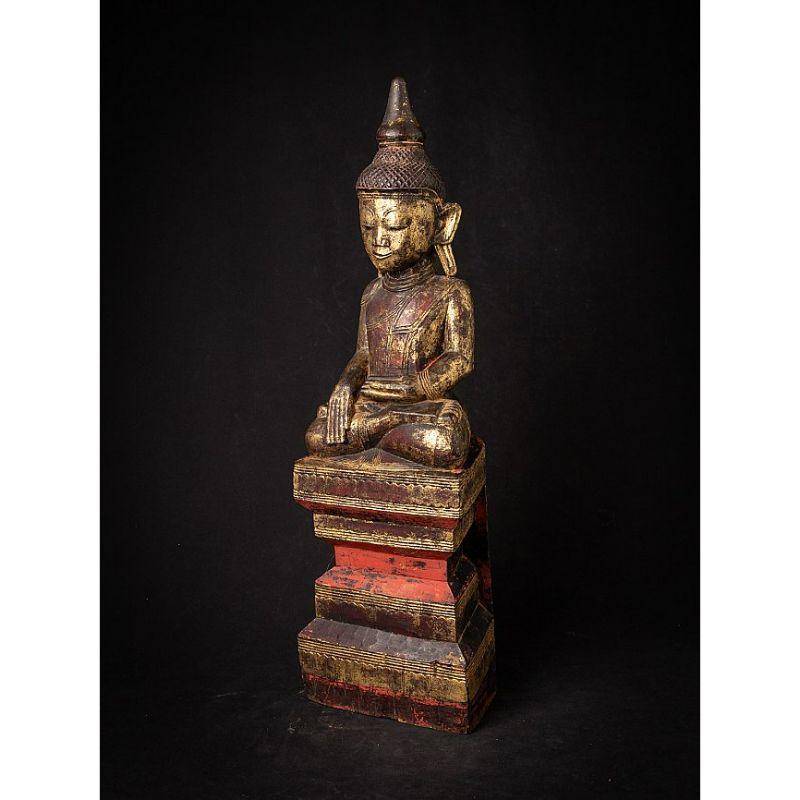 Material: wood
62,3 cm high 
19 cm wide and 12,4 cm deep
Weight: 3.347 kgs
Gilded with 24 krt. gold
Shan (Tai Yai) style
Bhumisparsha mudra
Originating from Burma
18th century

