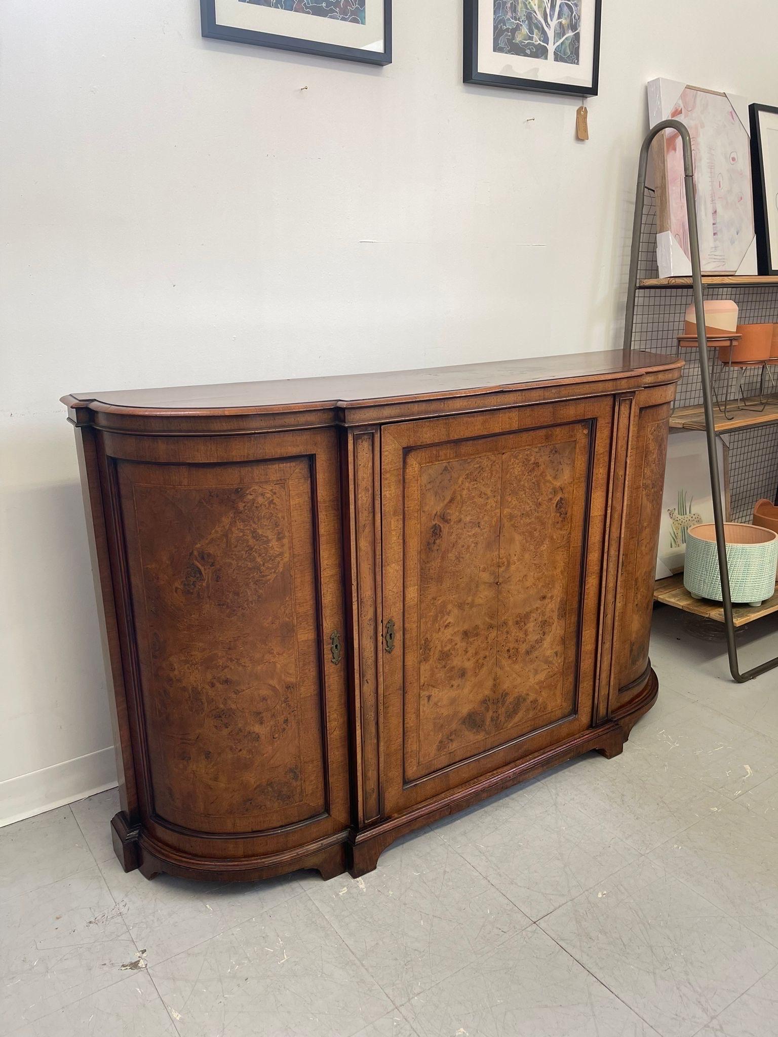 This beautiful Burl Accented piece has wood inlay features throughout. Wood has aged beautifully. Possibly Pre 1950s as wood seems to be hand-paned. The cabinetry backing is velvet lined with stable shelving in each section. Original keys with