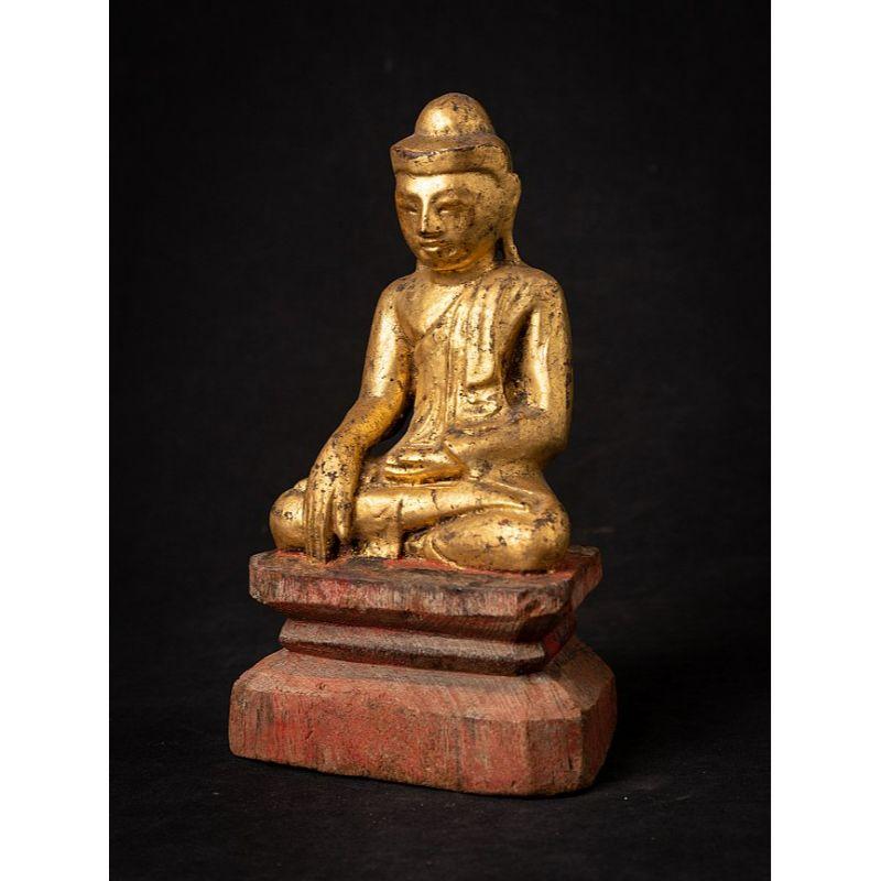 Material: wood
22,3 cm high 
13,6 cm wide and 8,6 cm deep
Weight: 0.388 kgs
Gilded with 24 krt. gold
Mandalay style
Bhumisparsha mudra
Originating from Burma
19th century

