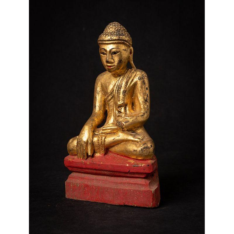 Material: wood
24,3 cm high 
14 cm wide and 9 cm deep
Weight: 0.417 kgs
Gilded with 24 krt. gold
Mandalay style
Bhumisparsha mudra
Originating from Burma
19th century

