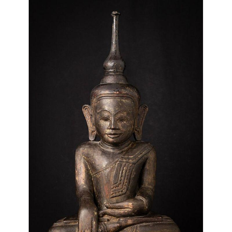 Material: wood
72 cm high 
28,3 cm wide and 22,2 cm deep
Weight: 8.8 kgs
With light traces of 24 krt. gilding
Shan (Tai Yai) style
Bhumisparsha mudra
Originating from Burma
18th century

