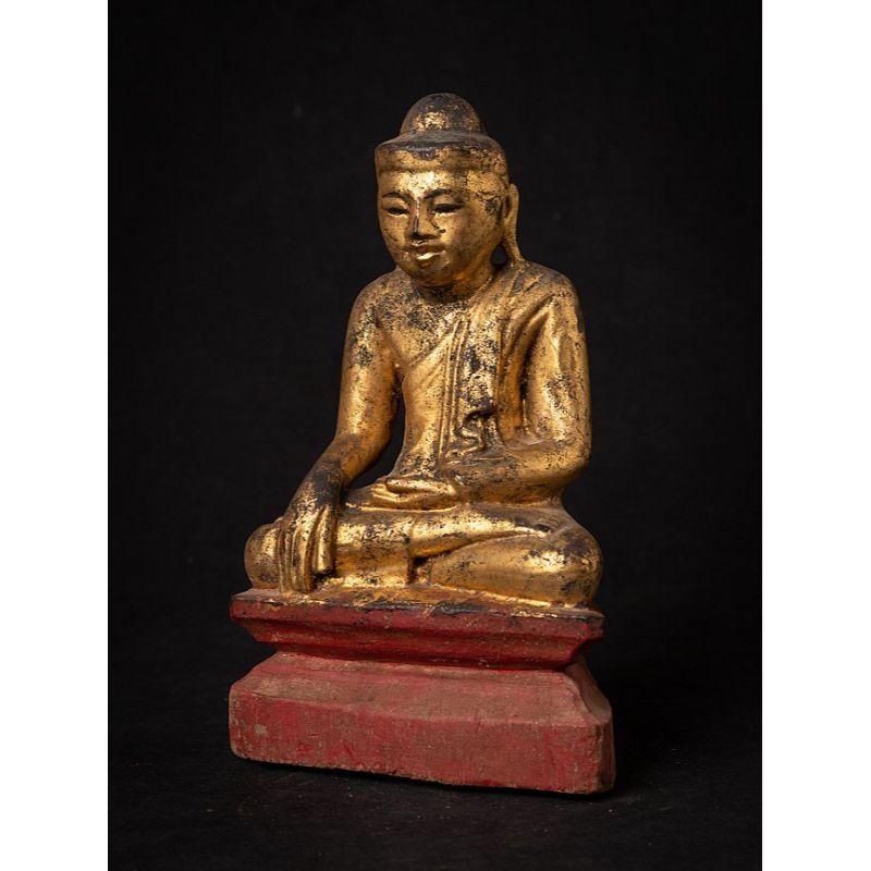 Material: wood
24 cm high 
15 cm wide and 9,3 cm deep
Weight: 0.387 kgs
Gilded with 24 krt. gold
Mandalay style
Bhumisparsha mudra
Originating from Burma
19th century

